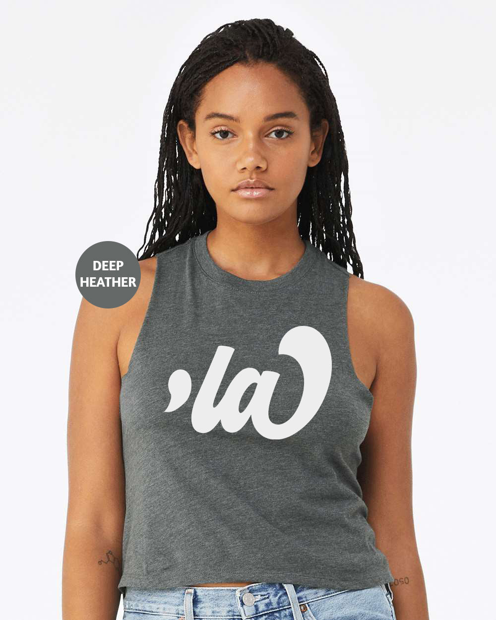 a woman wearing a grey tank top with a white logo