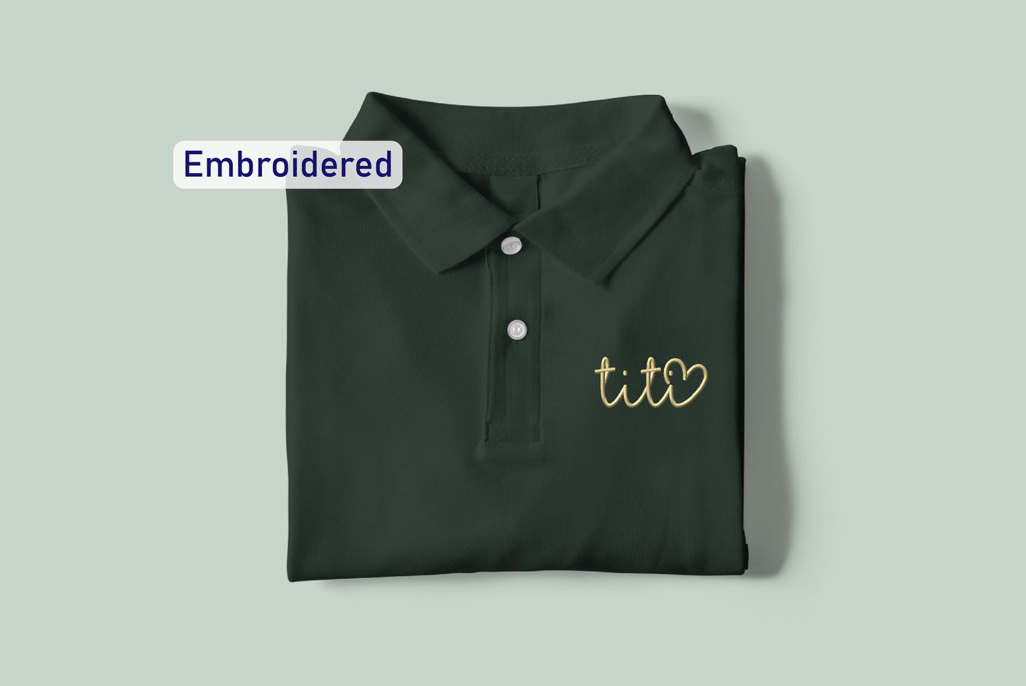 a green polo shirt with the words embroidered on it