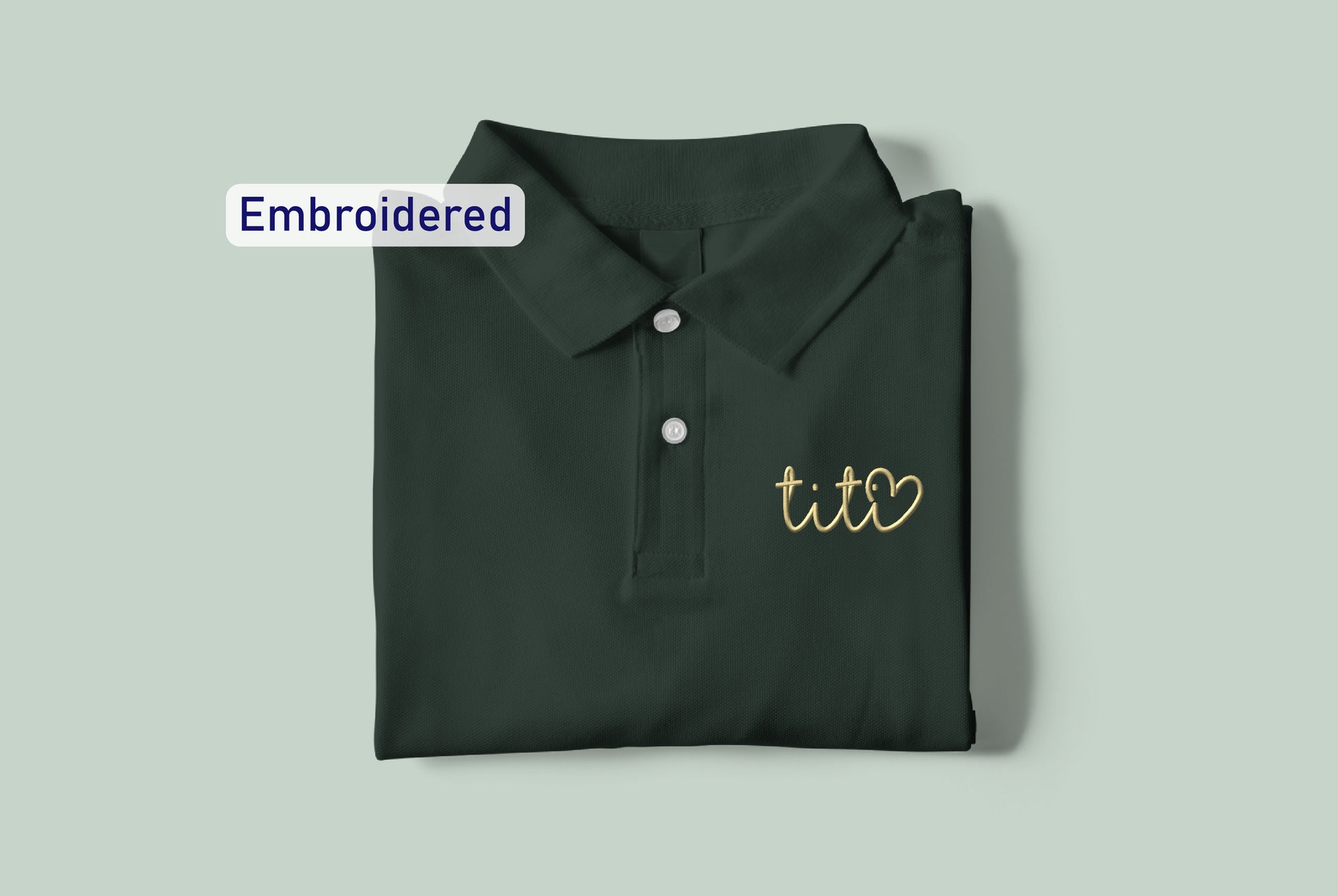 a green polo shirt with the words embroidered on it