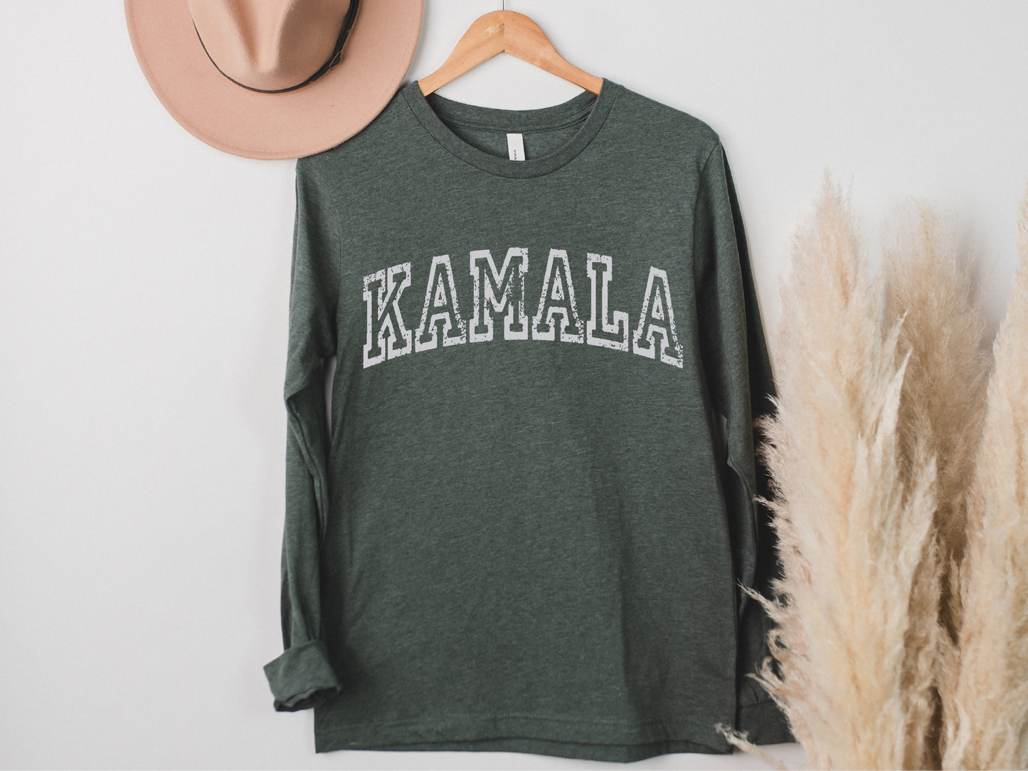a hat and a t - shirt hanging on a wall