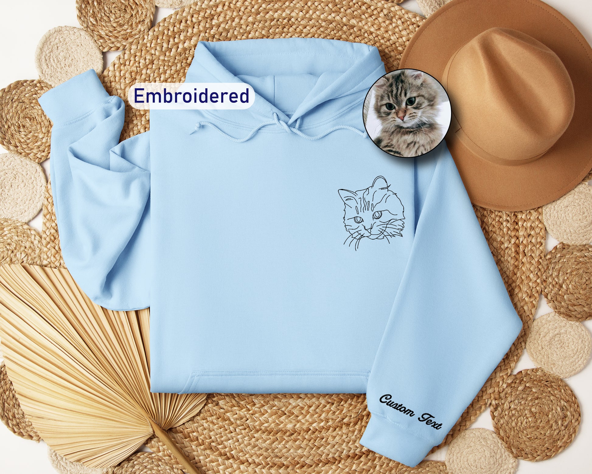a blue hoodie with a picture of a cat on it