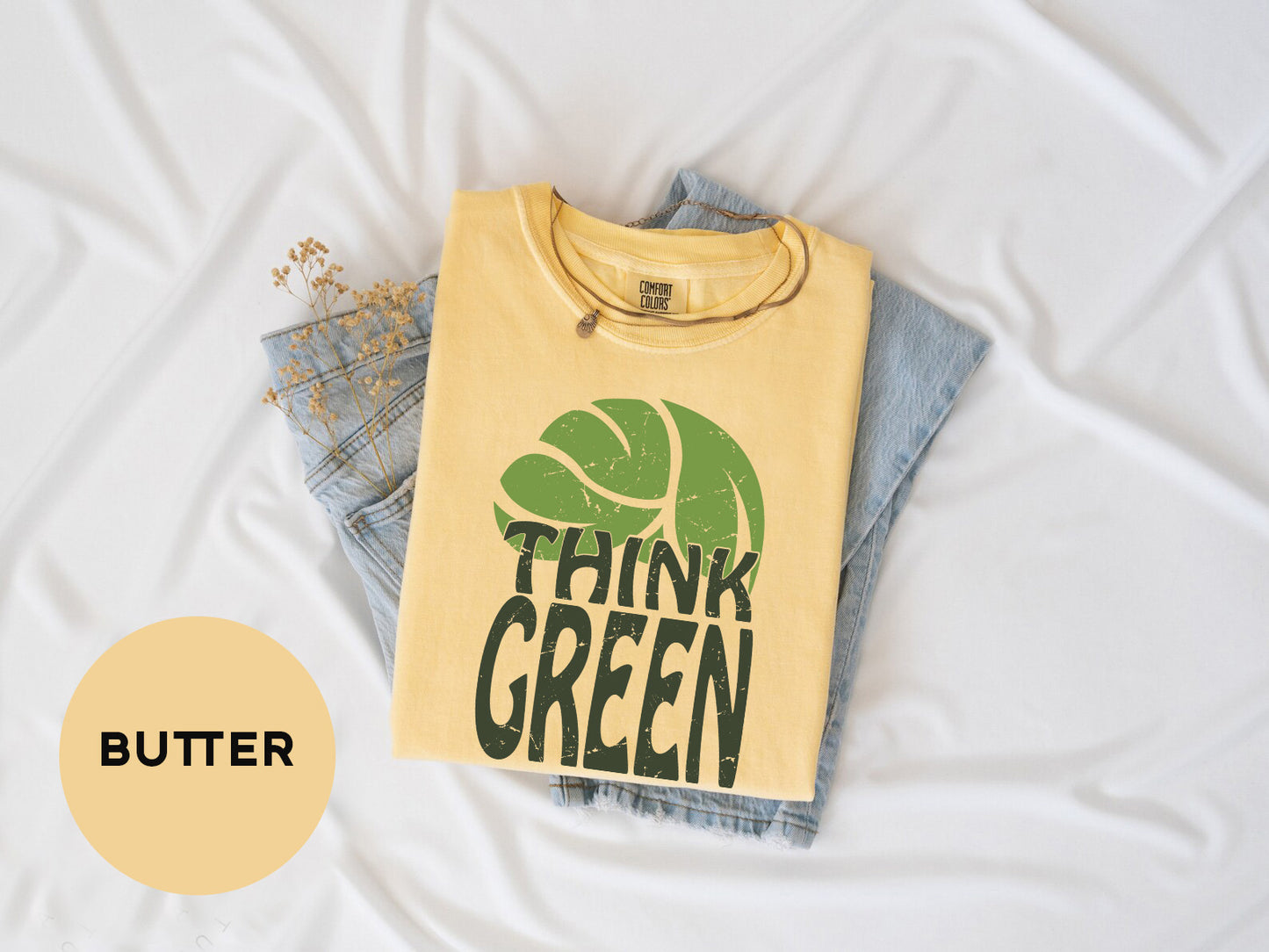 a yellow shirt that says think green on it