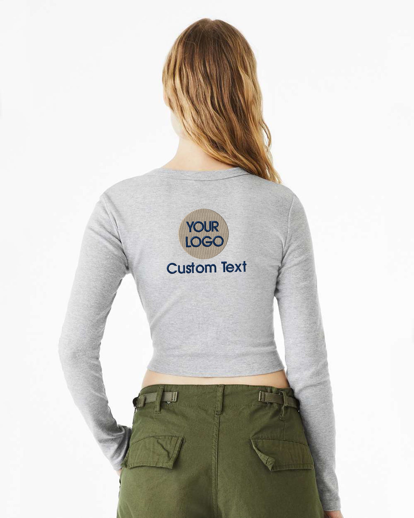 a woman wearing a long sleeved shirt with the words your logo on it