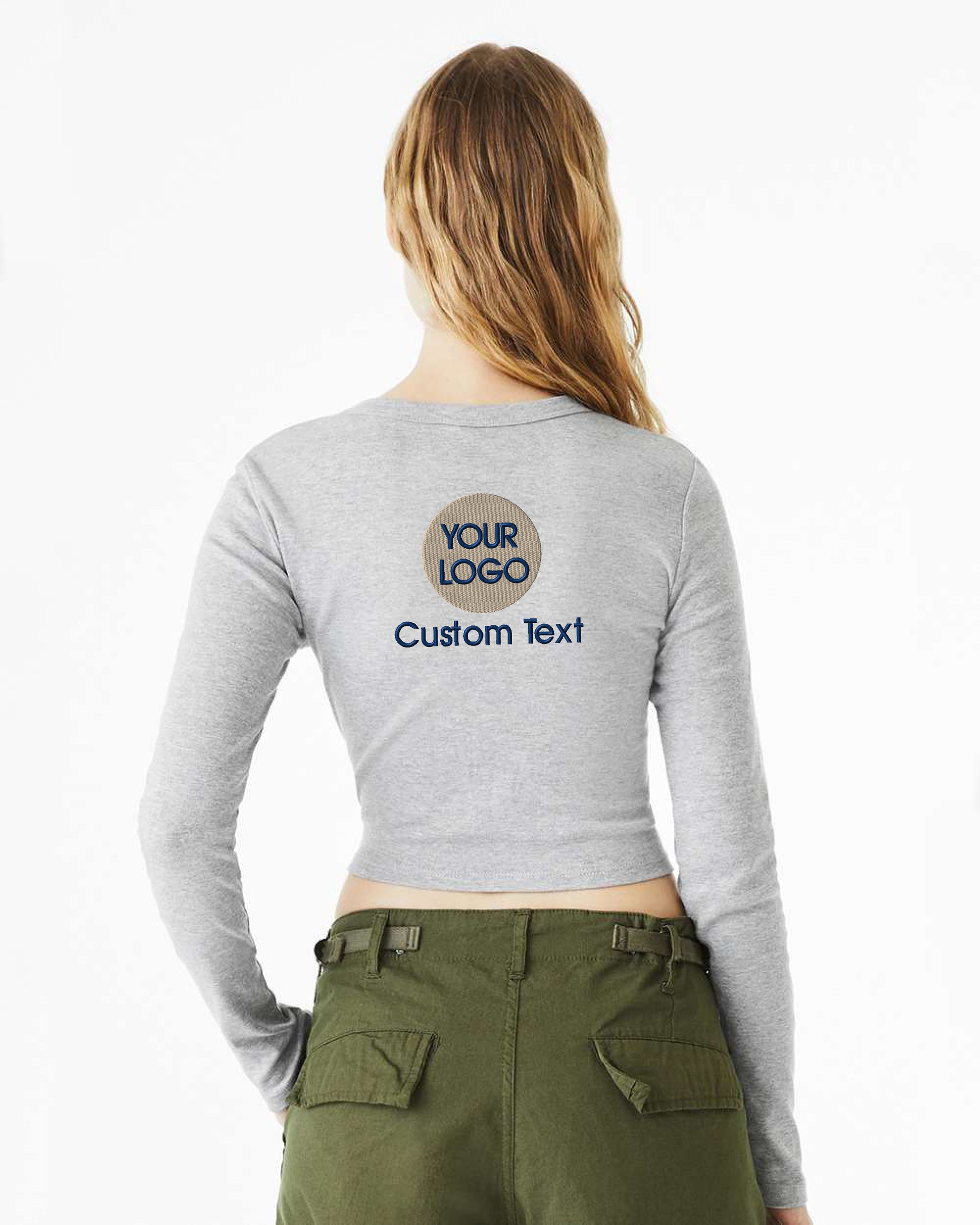 a woman wearing a long sleeved shirt with the words your logo on it