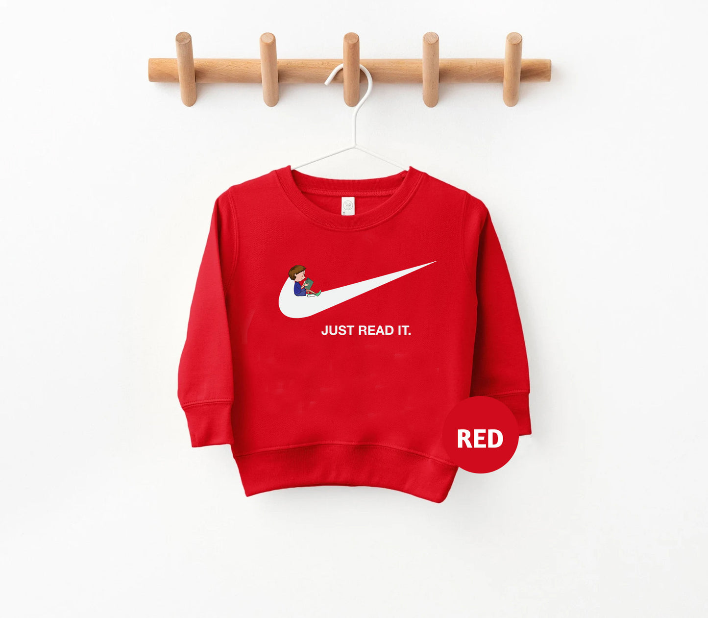 a red sweatshirt hanging on a clothes rack