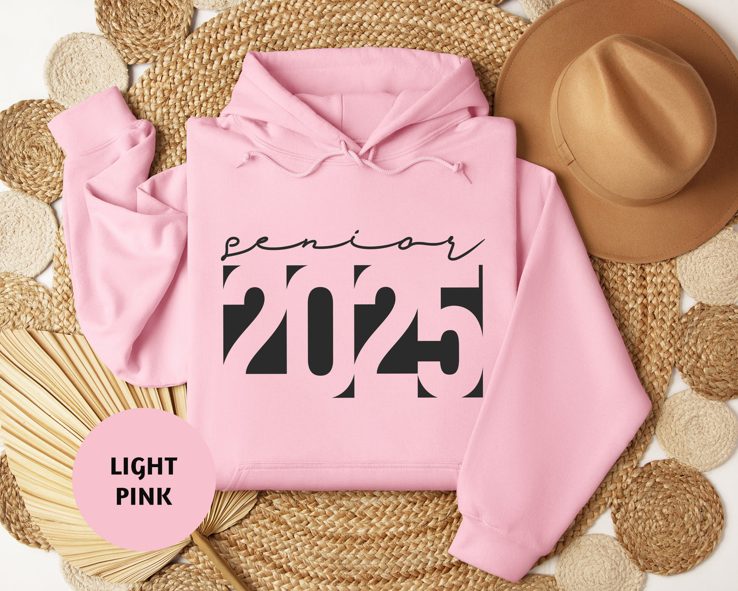 a pink hoodie with a hat on top of it