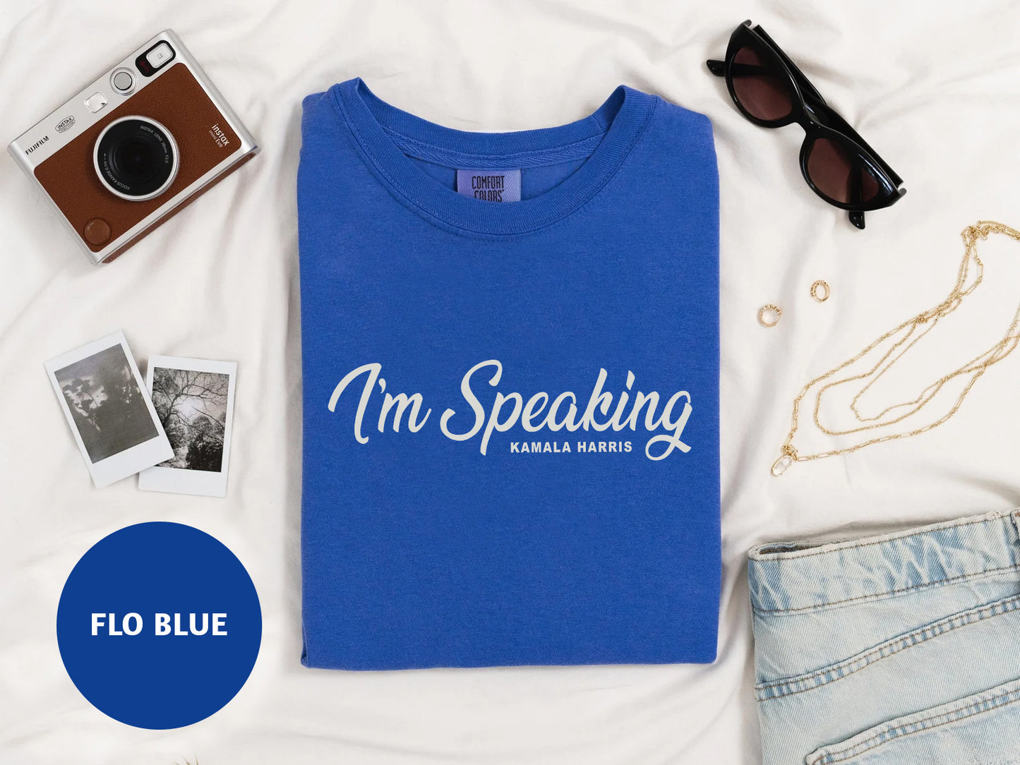 a blue t - shirt with the words i'm speaking on it next to