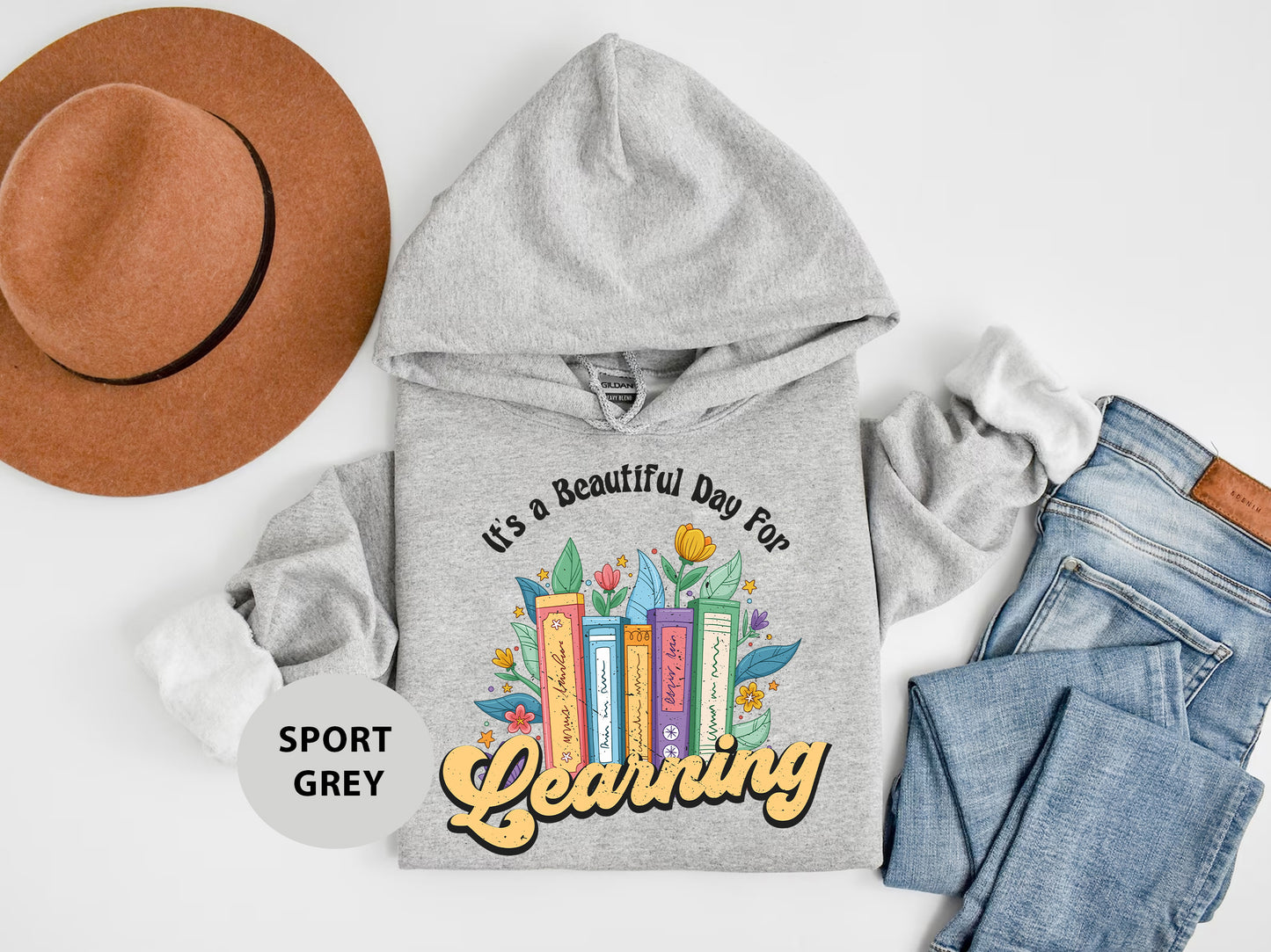 a hoodie, jeans, hat, and a pair of shoes