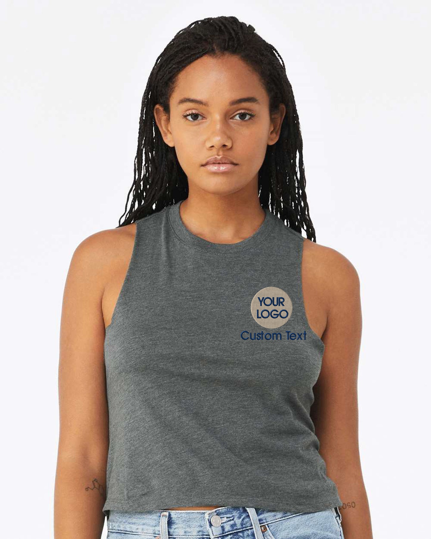 a woman wearing a tank top with a logo on it