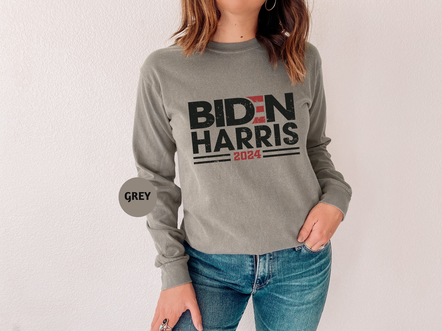 a woman wearing a grey shirt with the words bidn harris on it