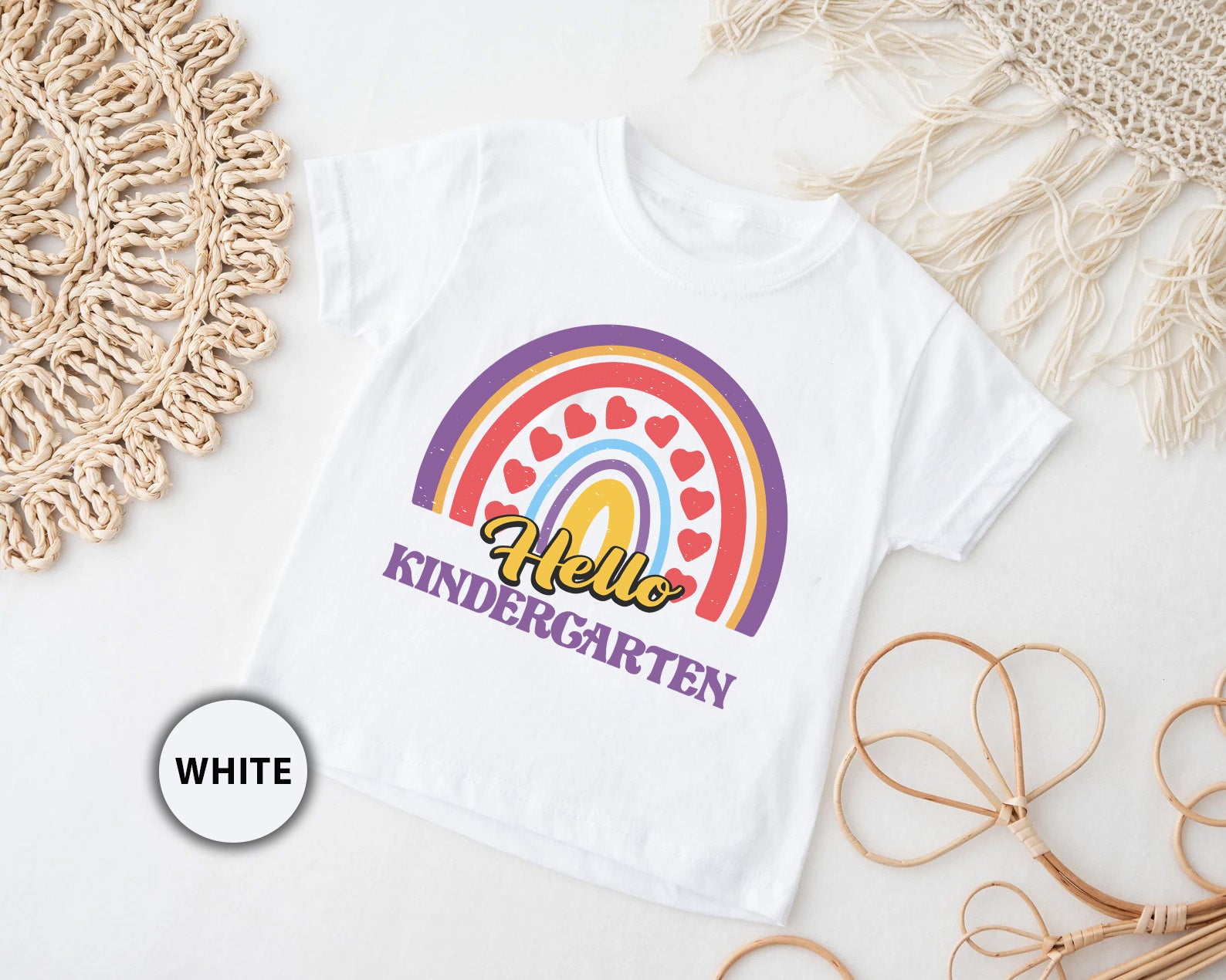 a white t - shirt with a rainbow and the words hello, kindergart