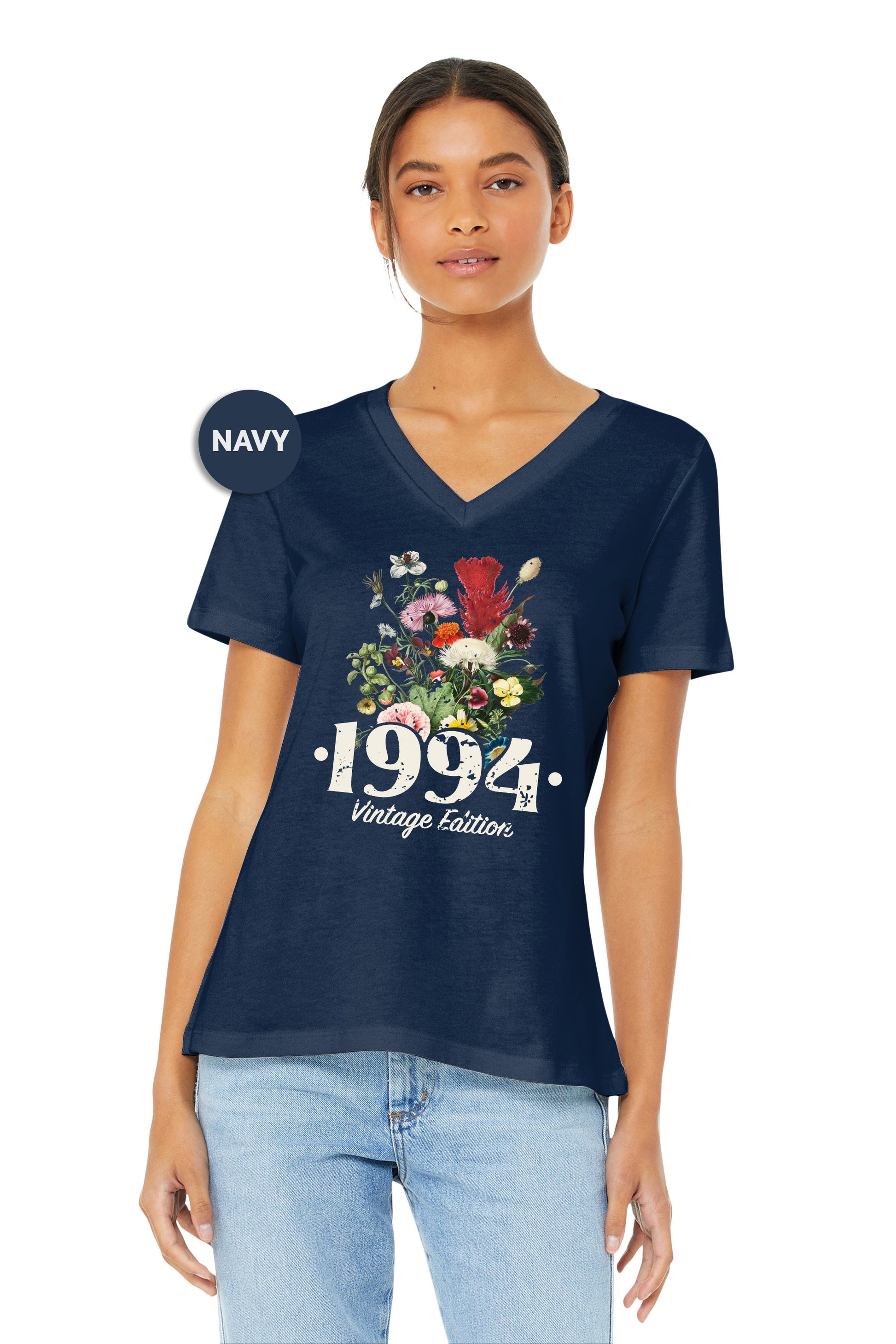 a woman wearing a navy shirt with flowers on it