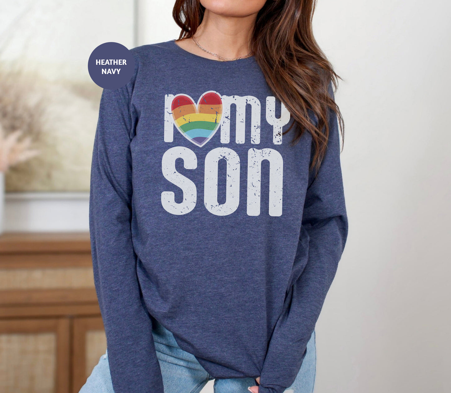 a woman wearing a sweatshirt that says i love my son