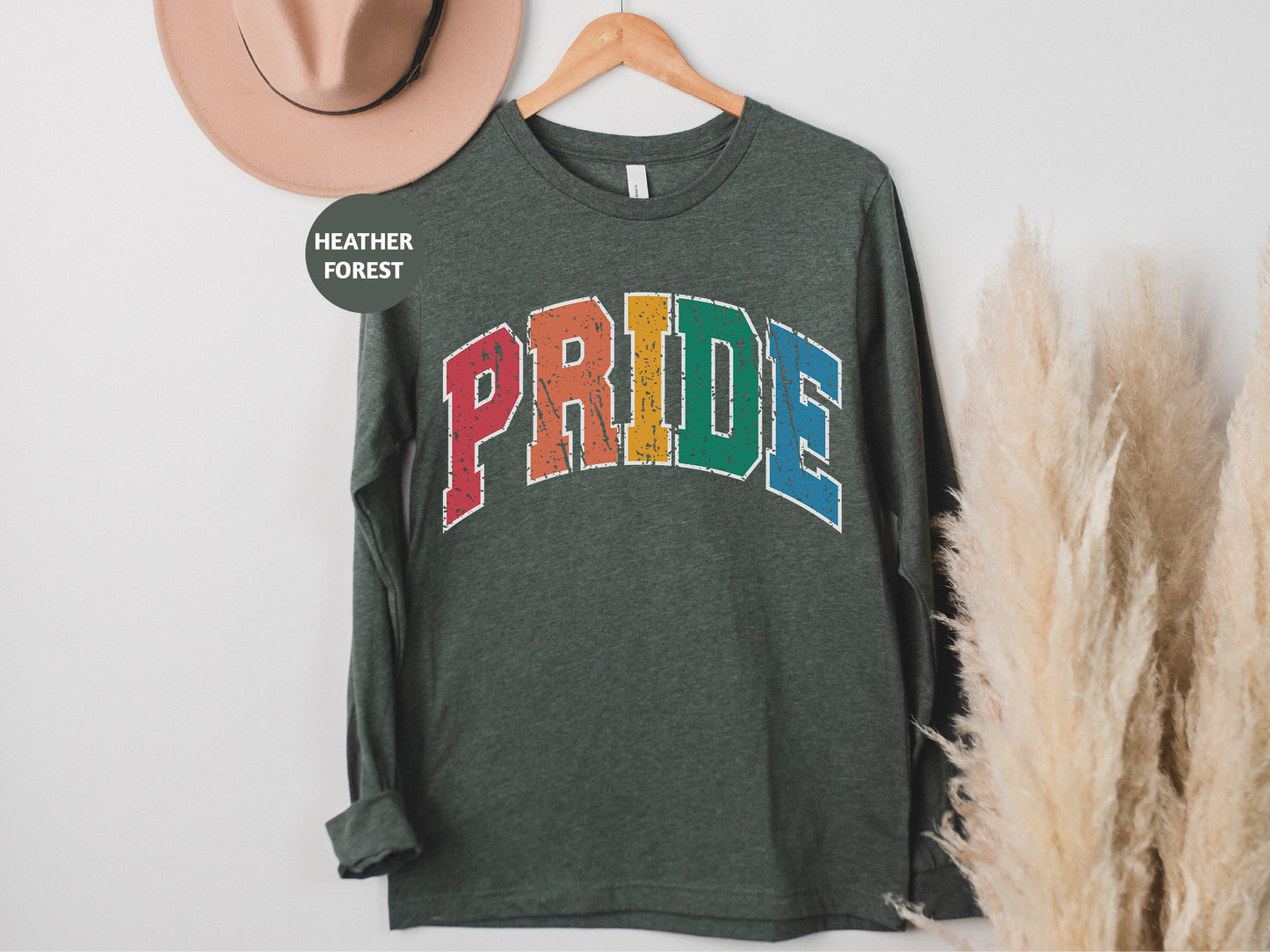a green shirt with the word pride on it