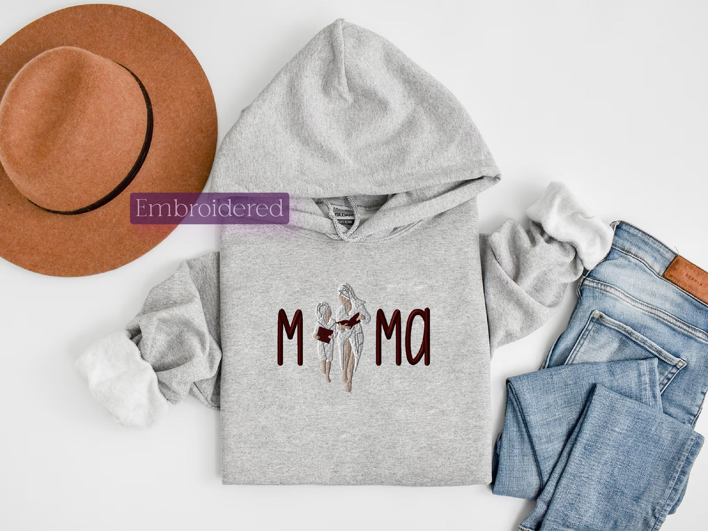 a gray hoodie with the word mom printed on it