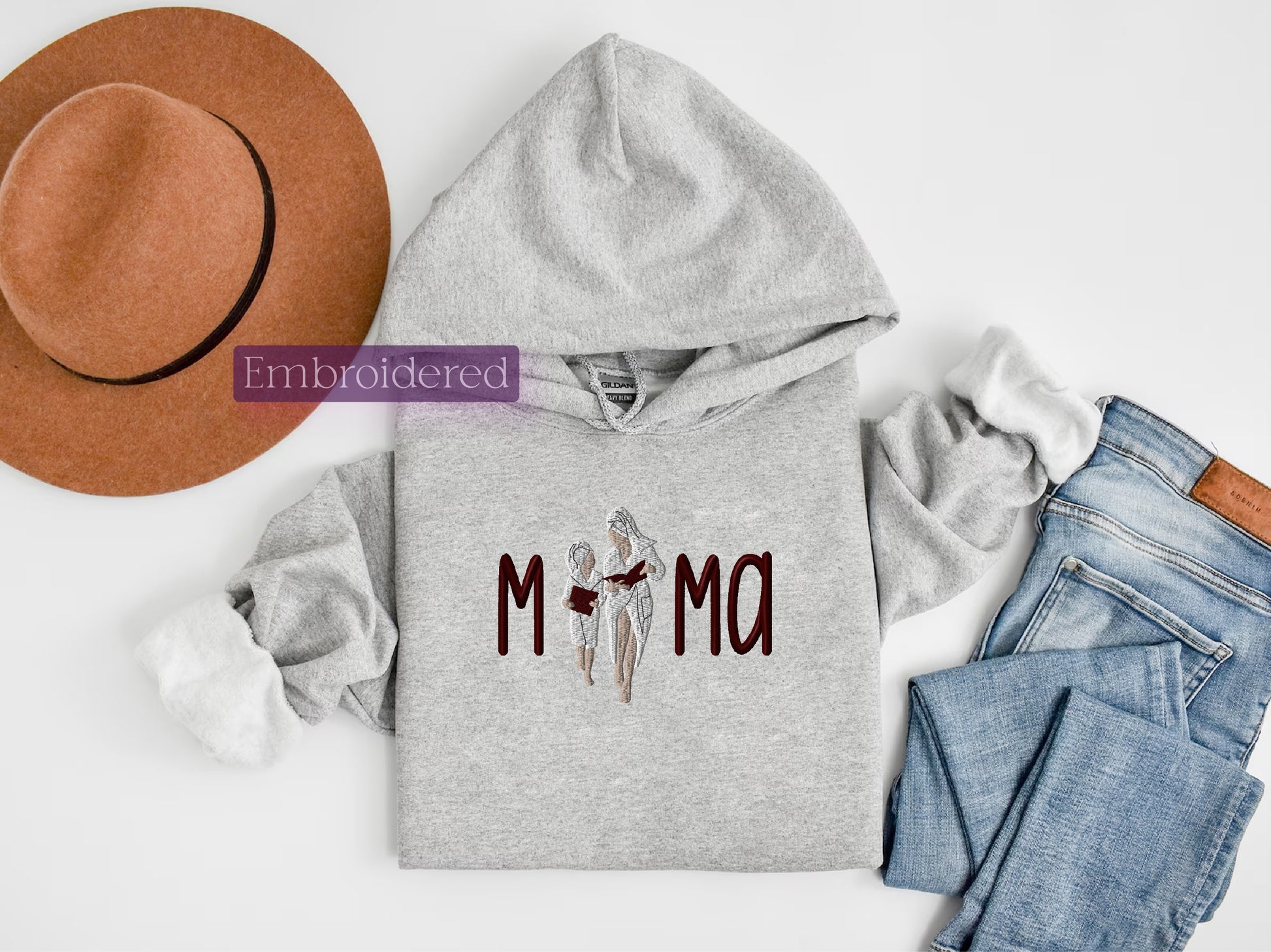 a gray hoodie with the word mom printed on it