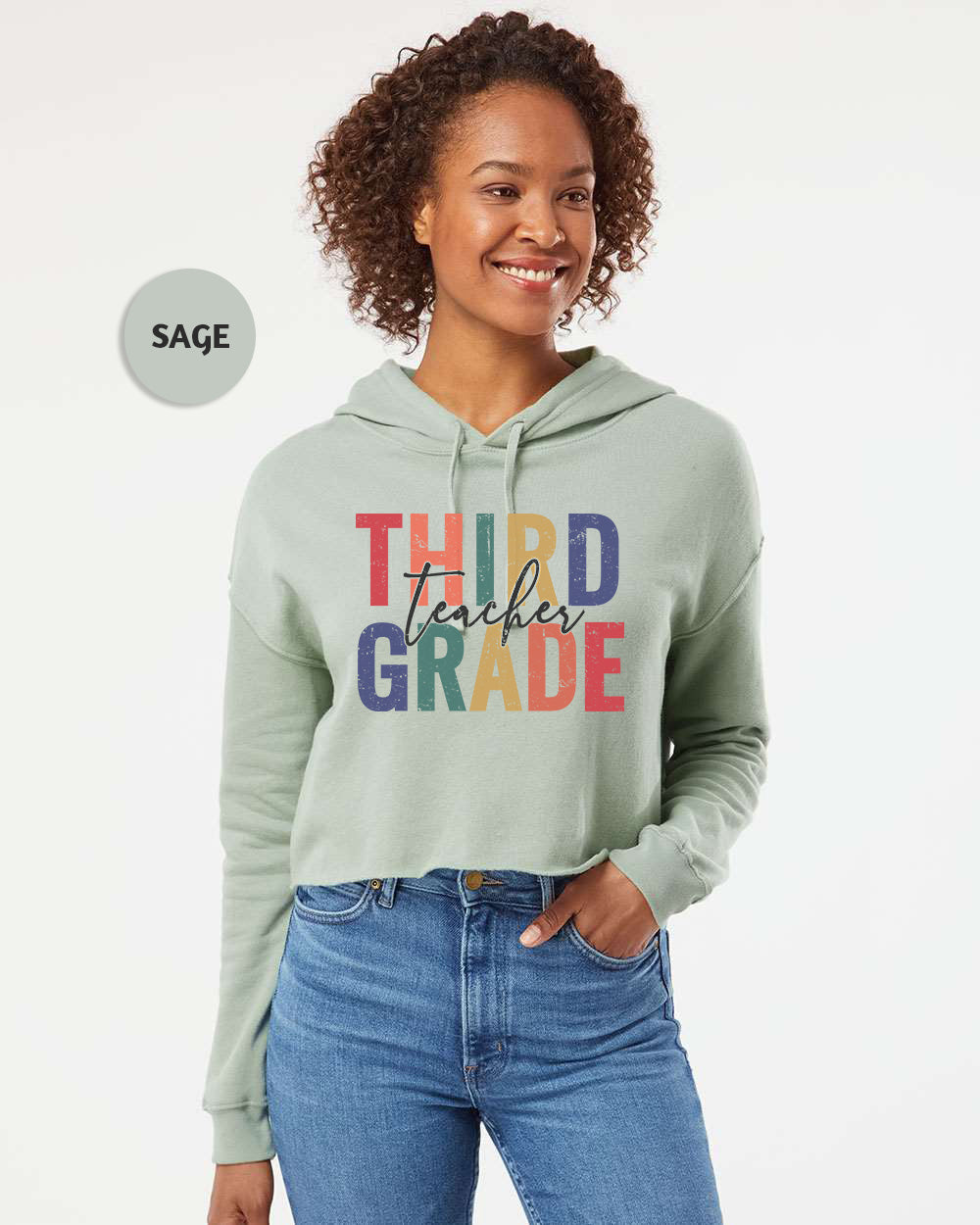 a woman wearing a green hoodie that says third grade