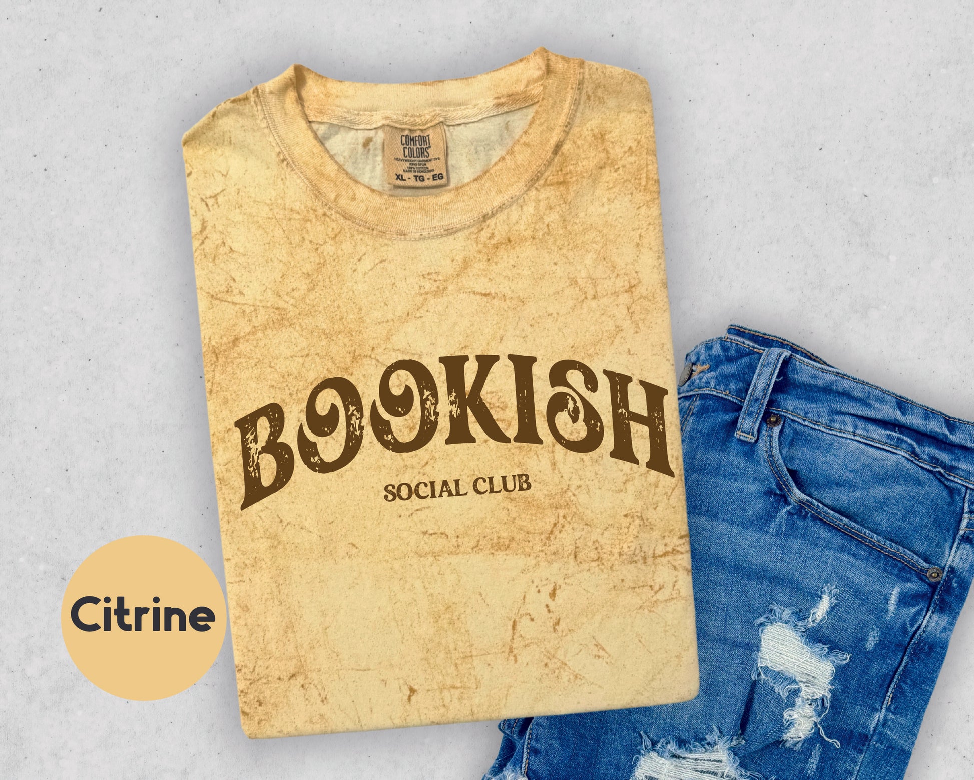 a t - shirt with the words booksh on it next to a pair of