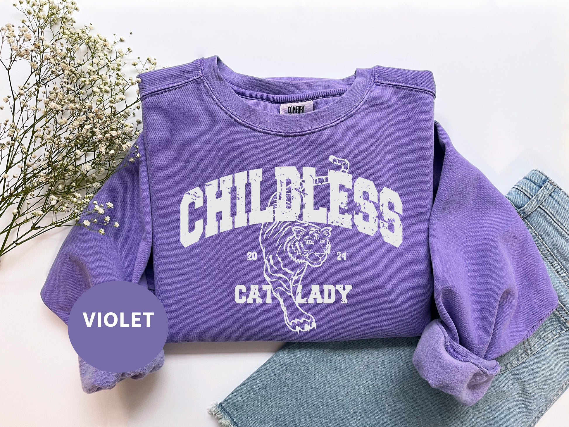 a purple shirt with a white tiger on it