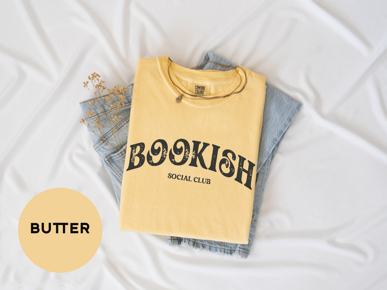 a yellow shirt with a bookish social club on it