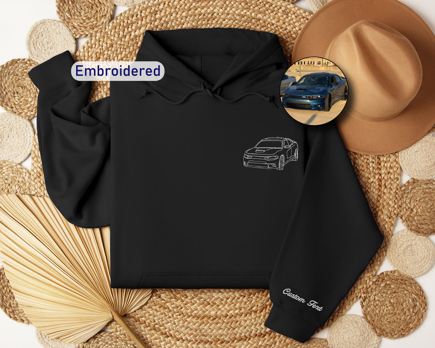 a black hoodie with a picture of a car on it