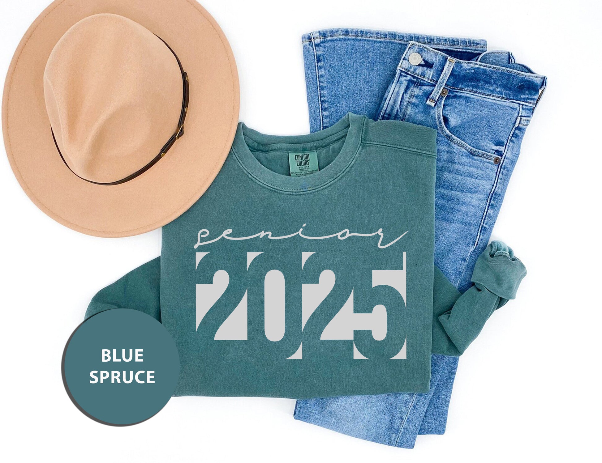 a pair of jeans, a hat, and a t - shirt on a white