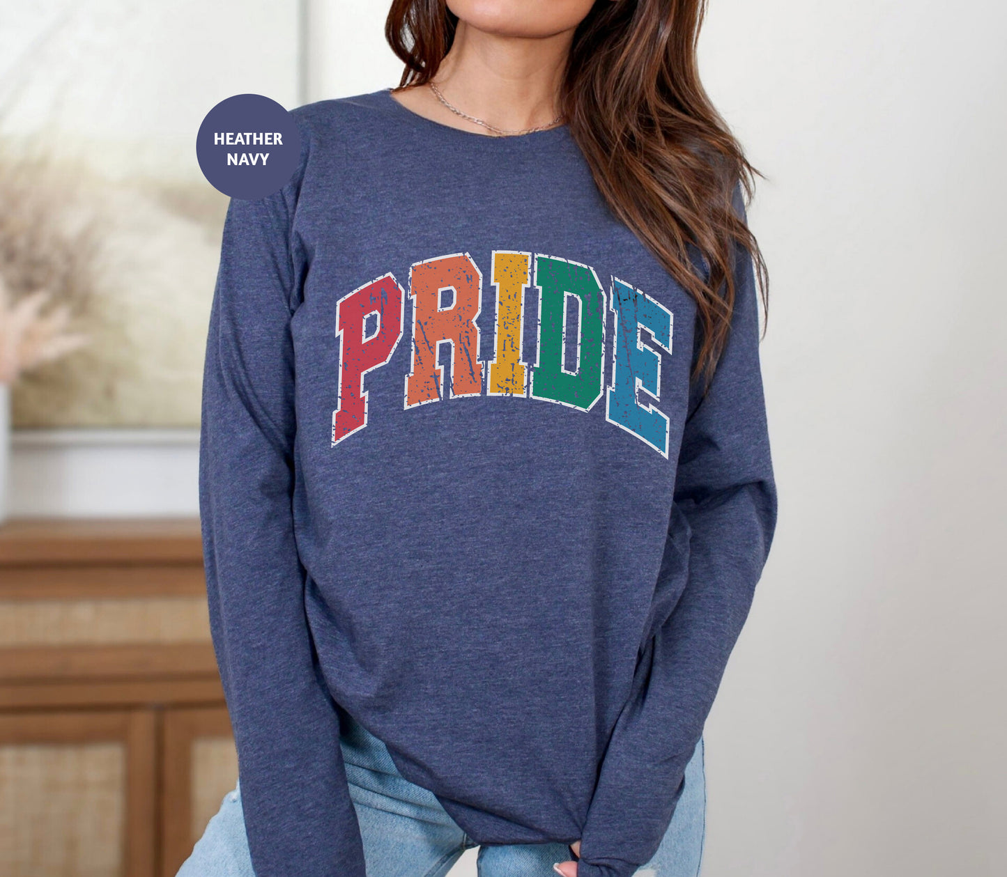 a woman wearing a sweatshirt with the word pride on it