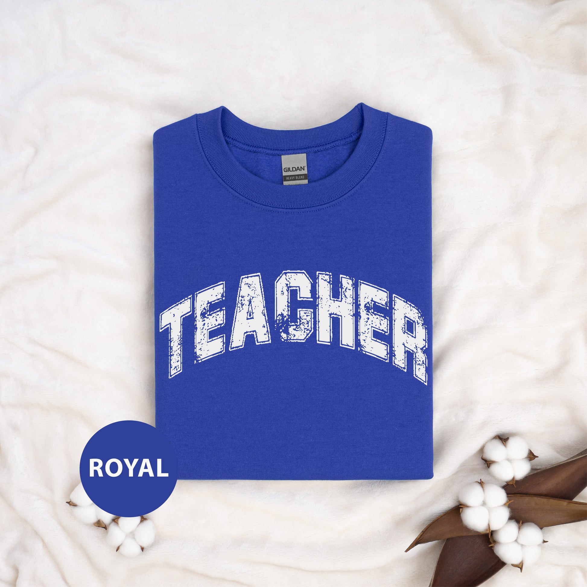 a blue shirt with the word teacher on it