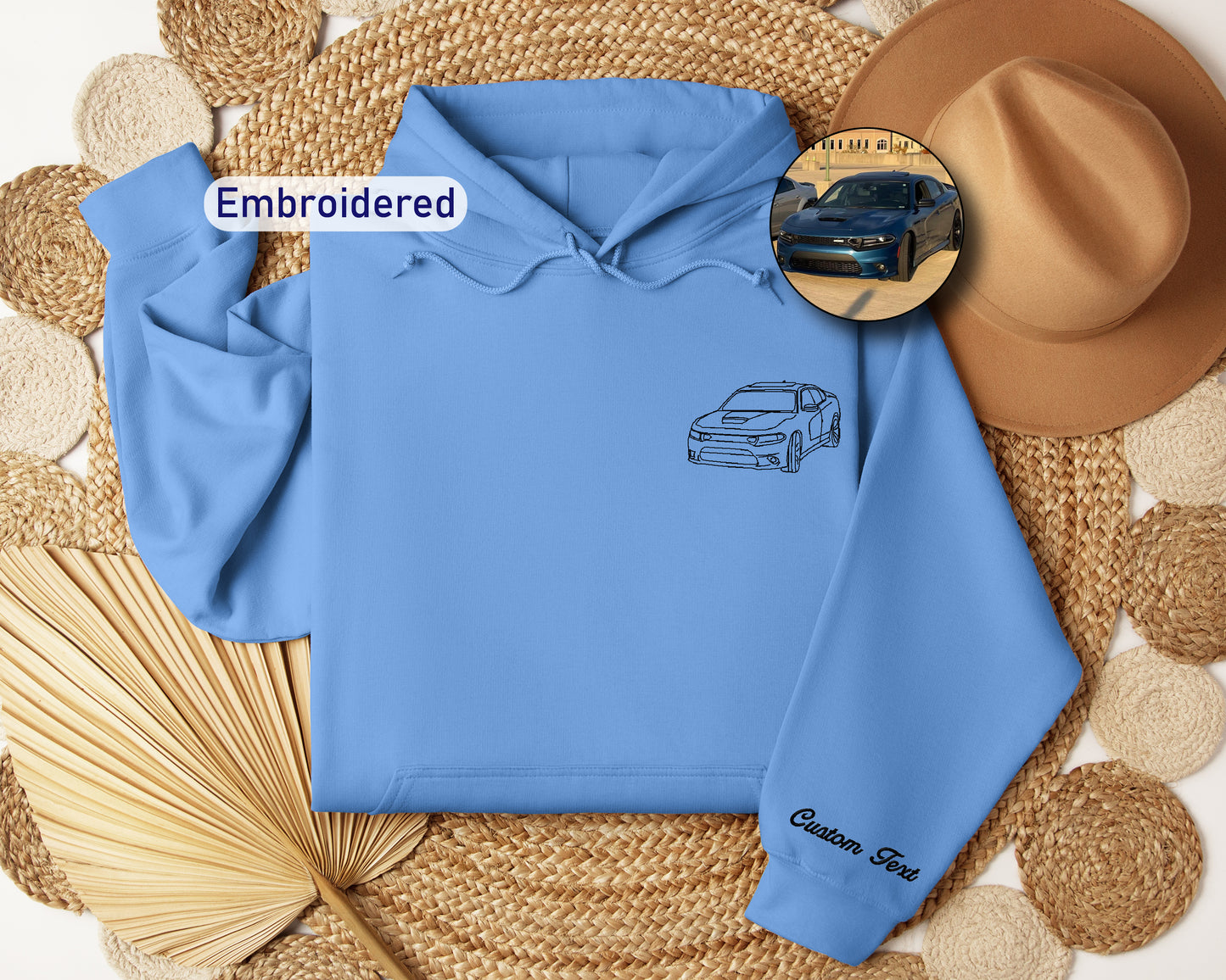 a blue hoodie with a picture of a car on it