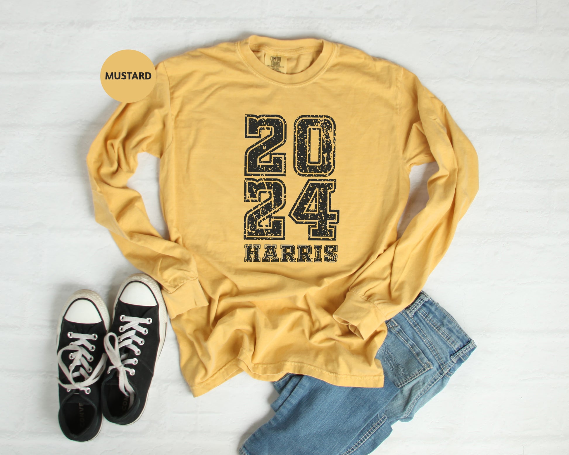 a pair of black sneakers and a yellow shirt