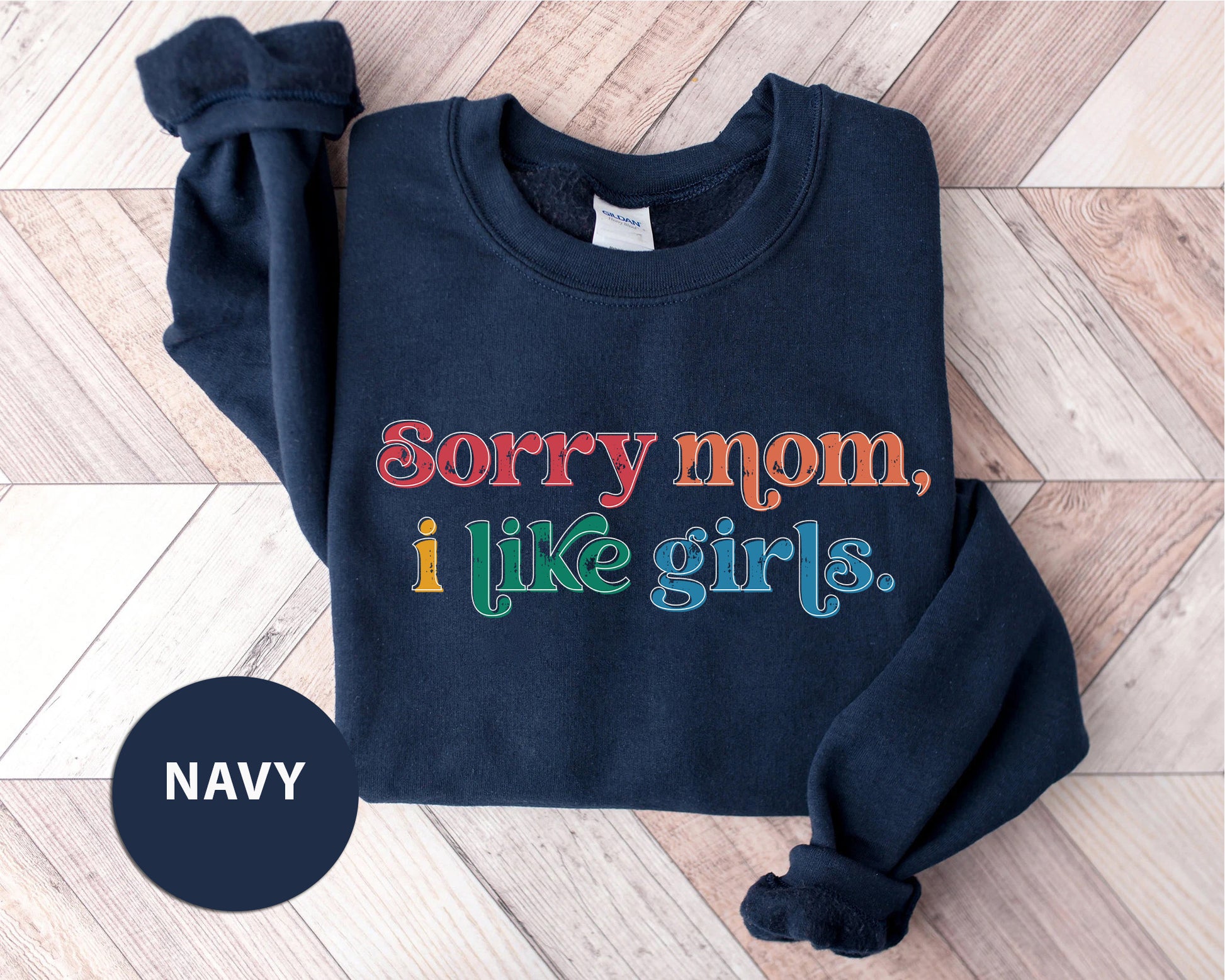 a navy sweatshirt that says sorry mom i like girls