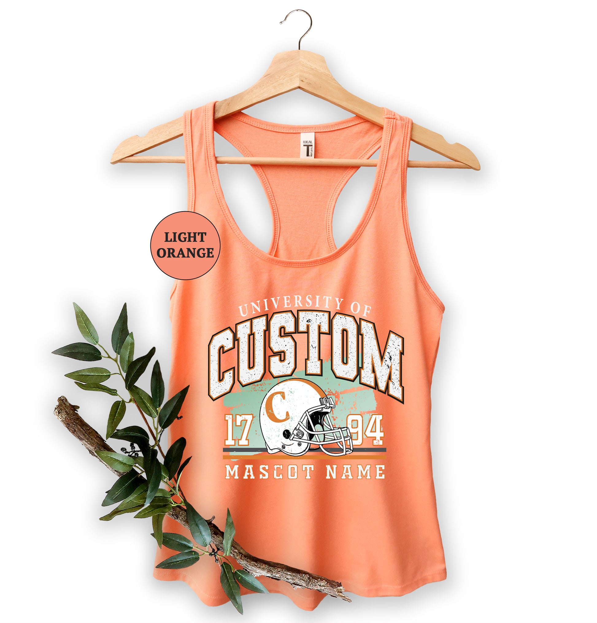 an orange tank top with a football helmet on it