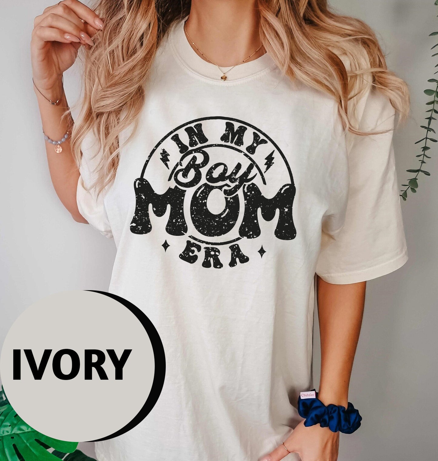 a woman wearing a t - shirt that says i'm my best mom ever