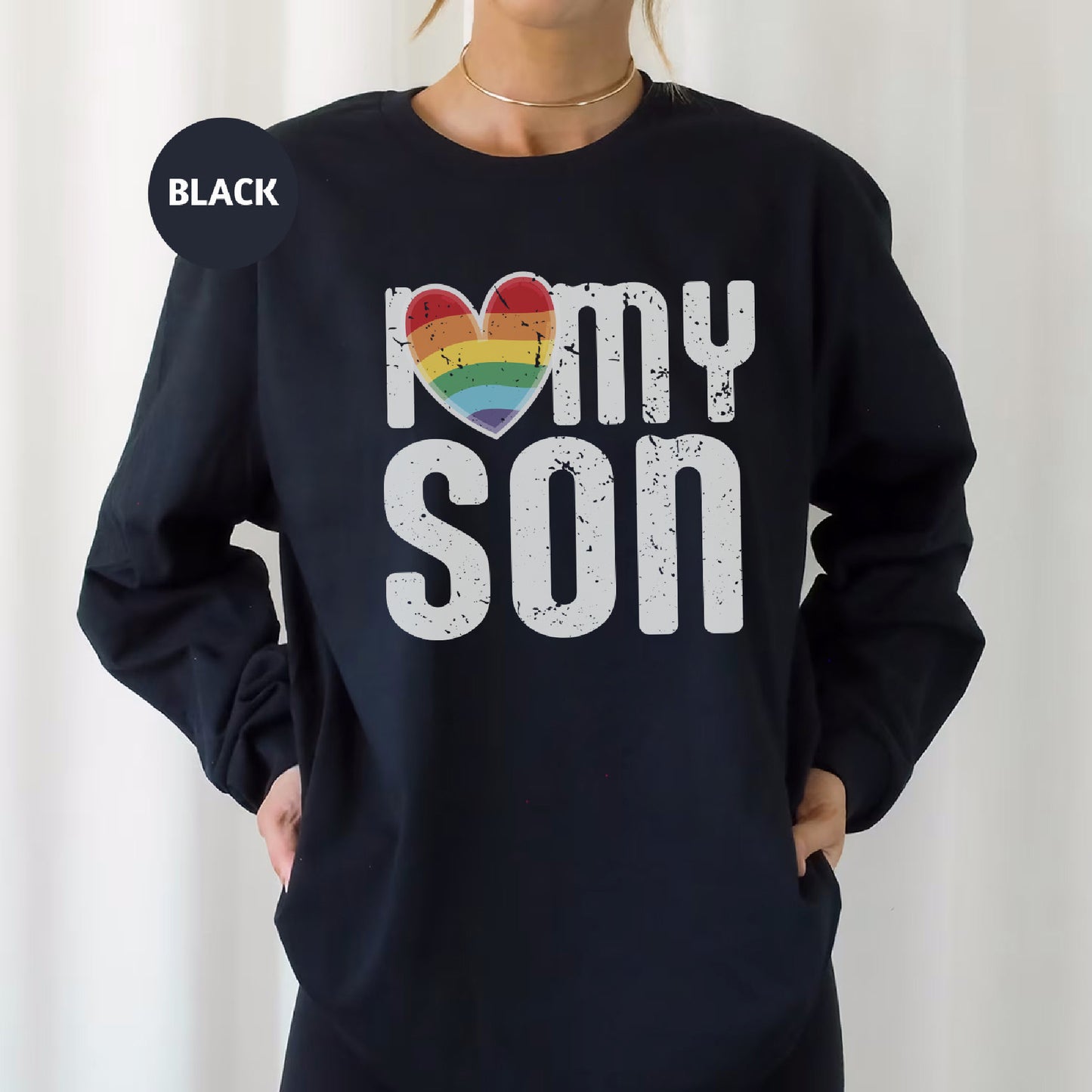 a woman wearing a black sweatshirt that says i love my son