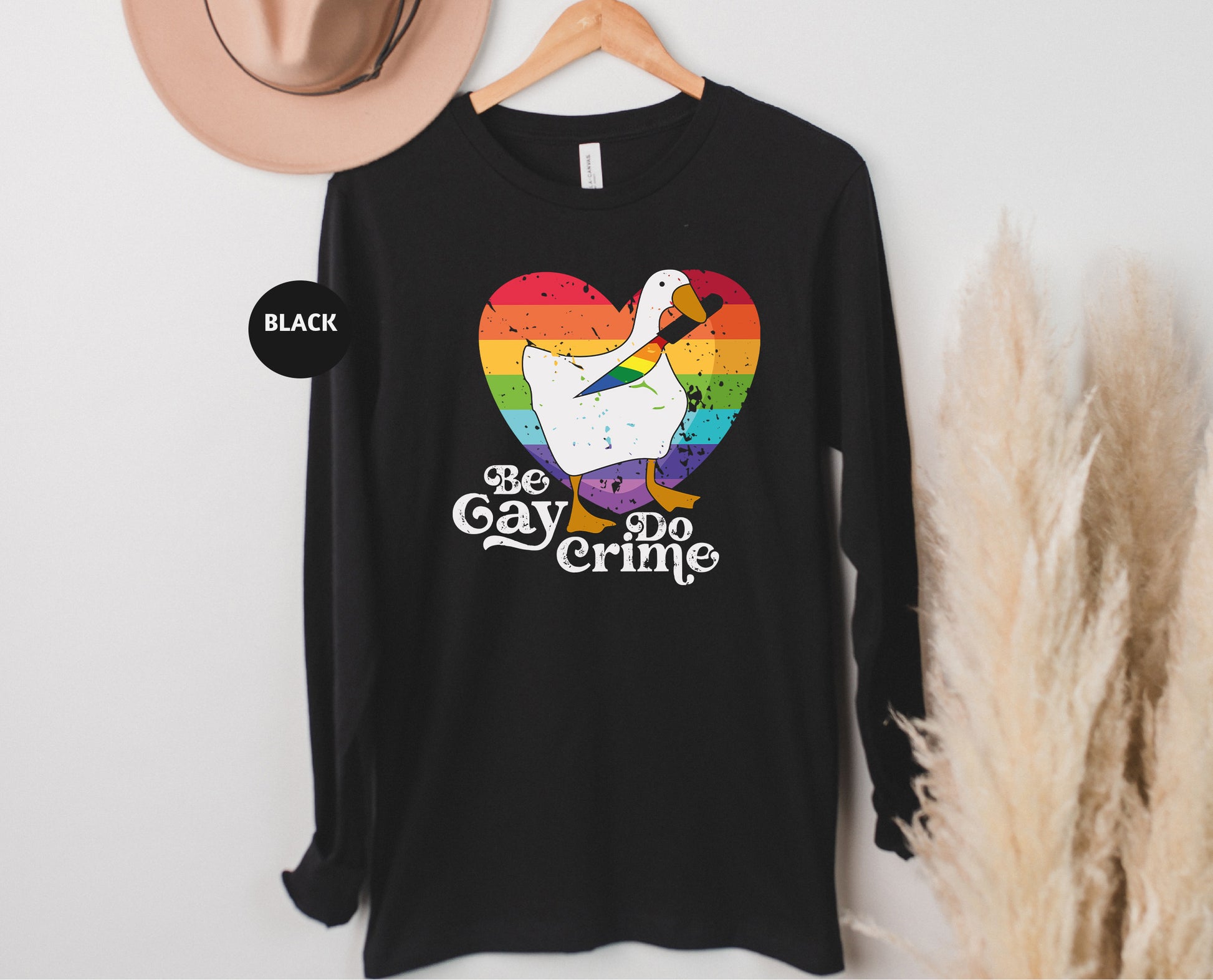 a black shirt with a white goose on it