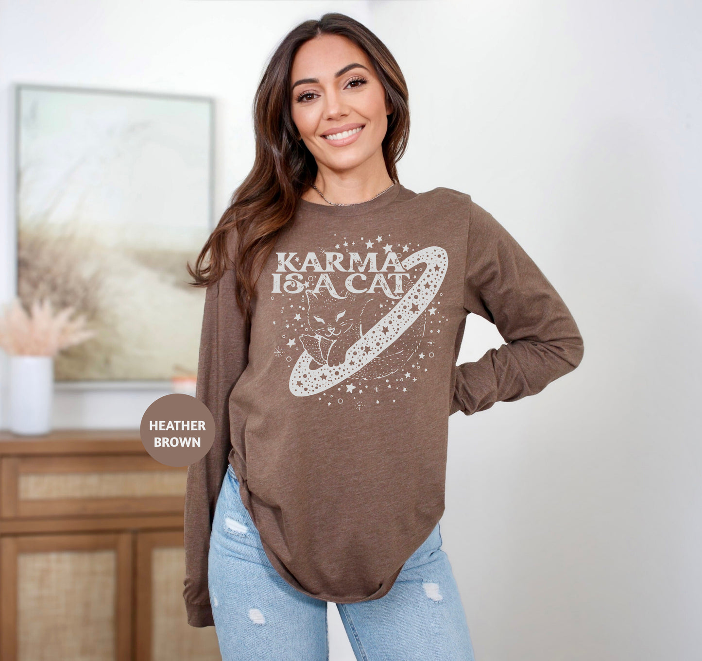 a woman standing in a room with her hands on her hips