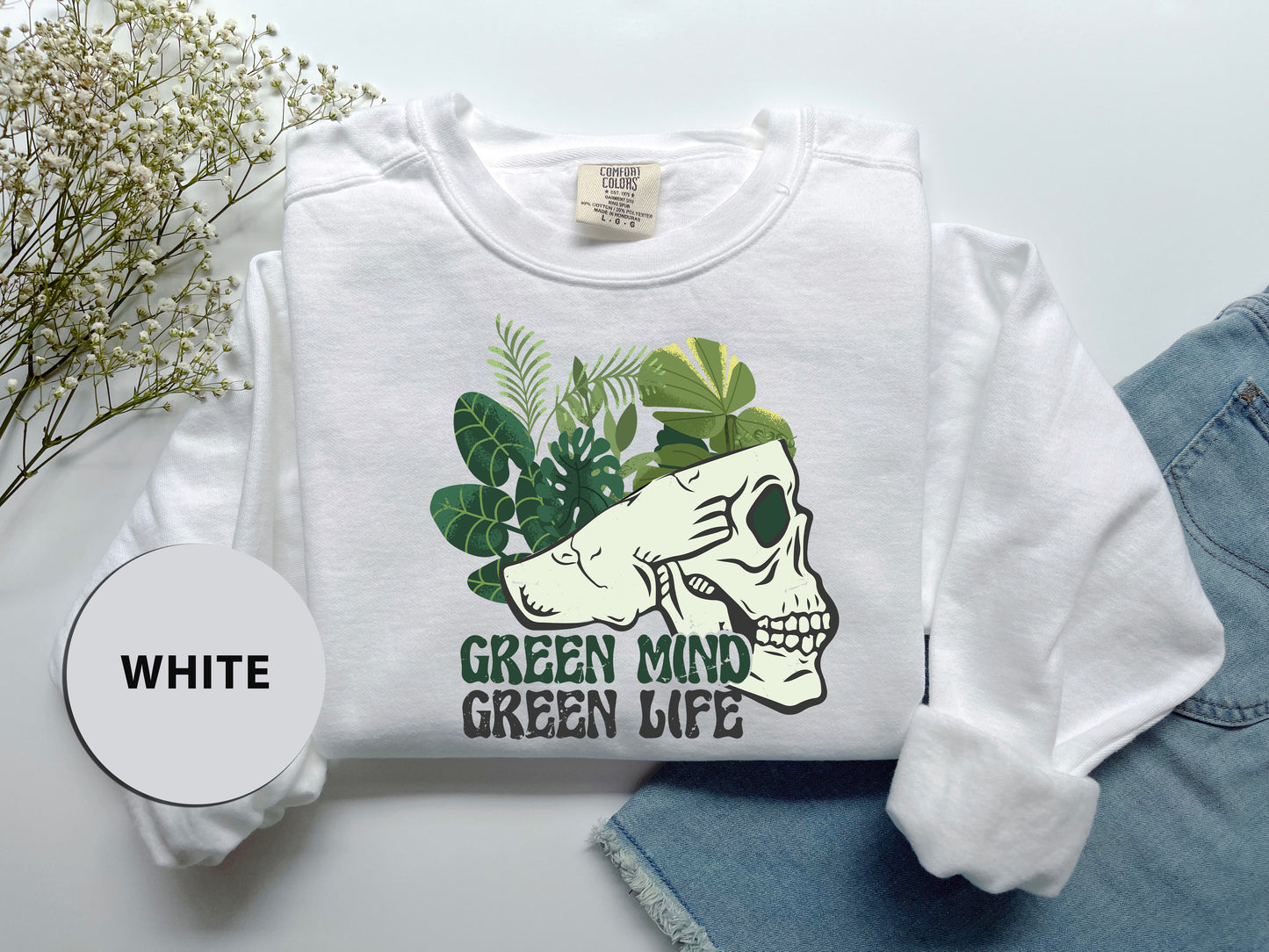 a white shirt with a green mind green life on it