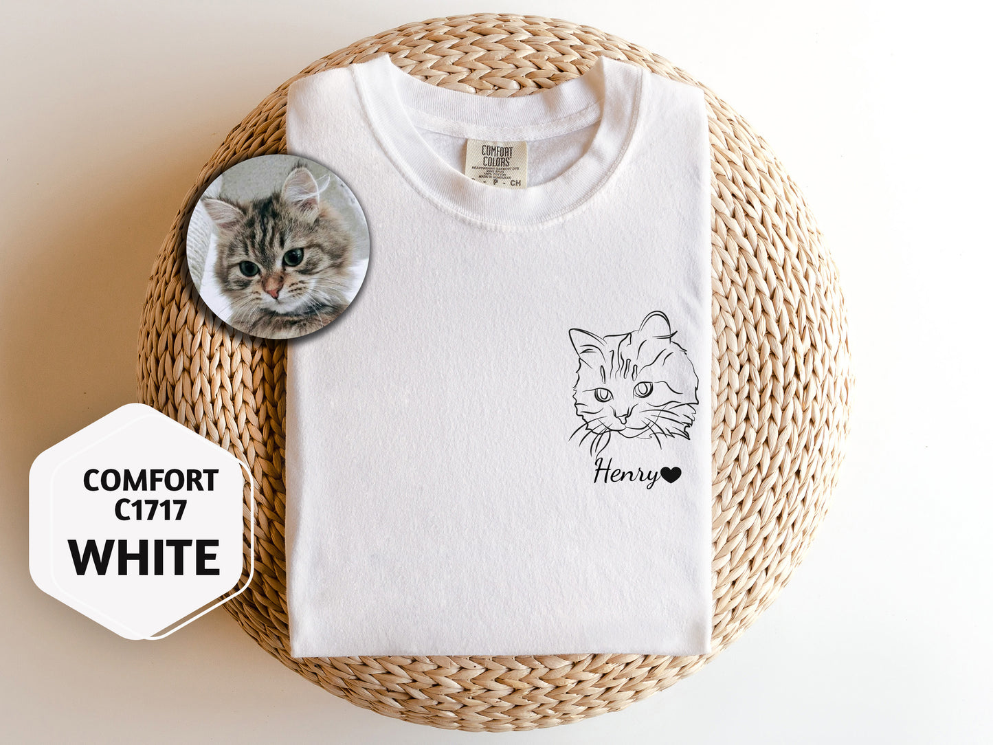 a white t - shirt with a picture of a cat on it