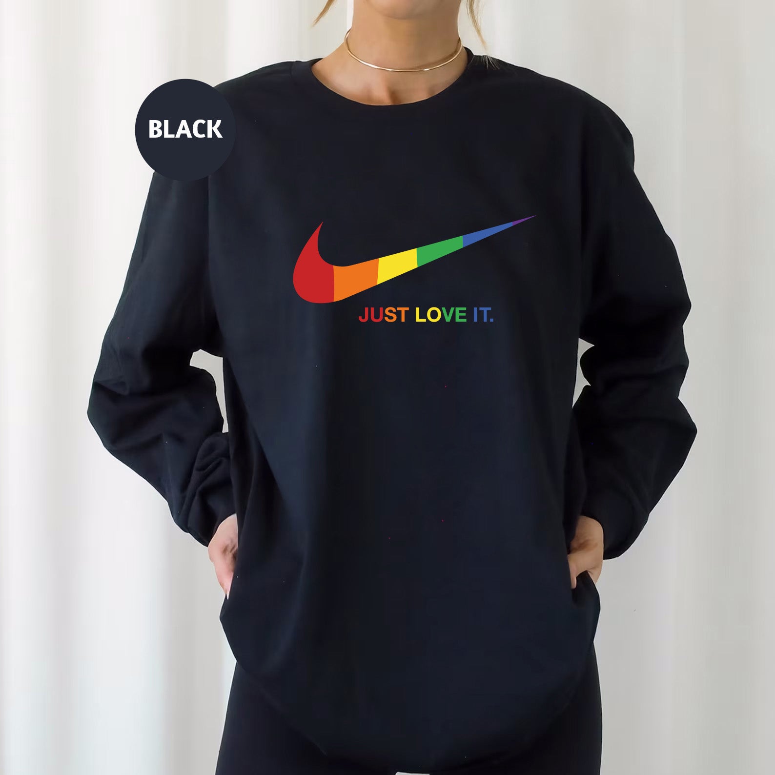 a woman wearing a black nike sweatshirt with the words just love it