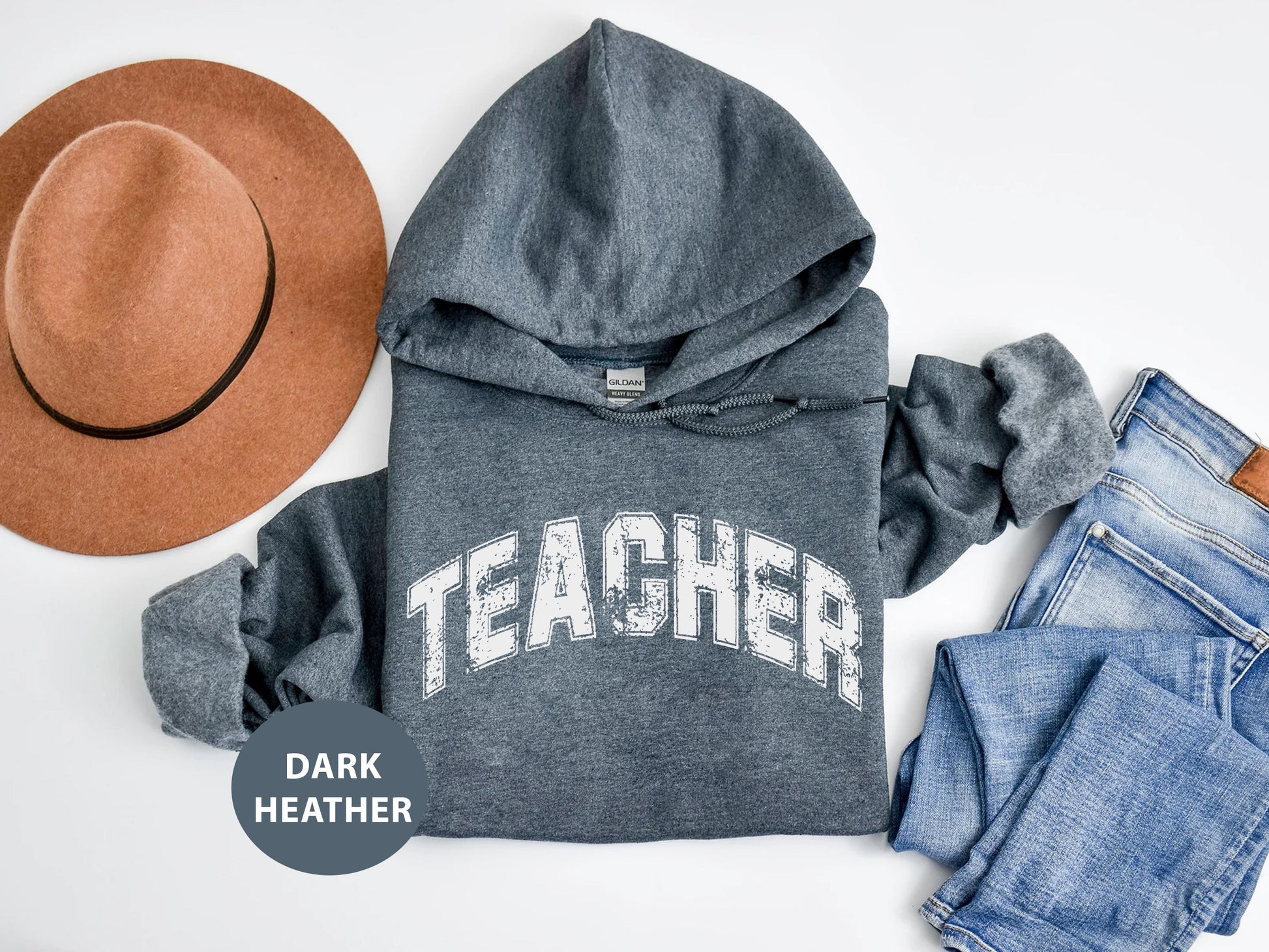 a hoodie, jeans, hat, and a pair of shoes