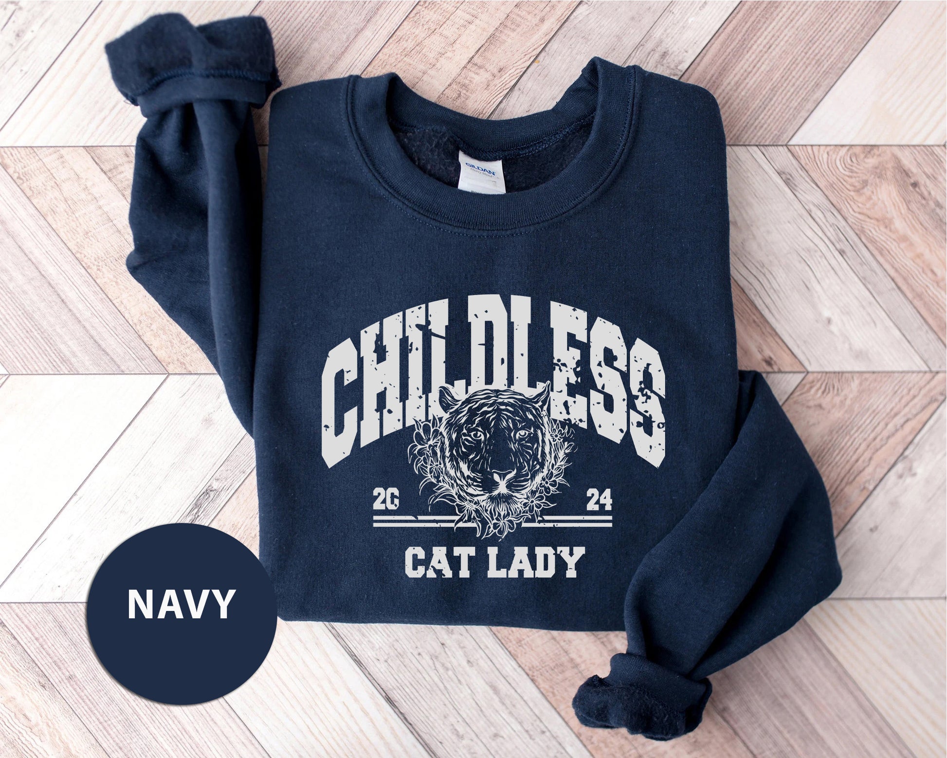 a navy sweatshirt with a cat lady on it