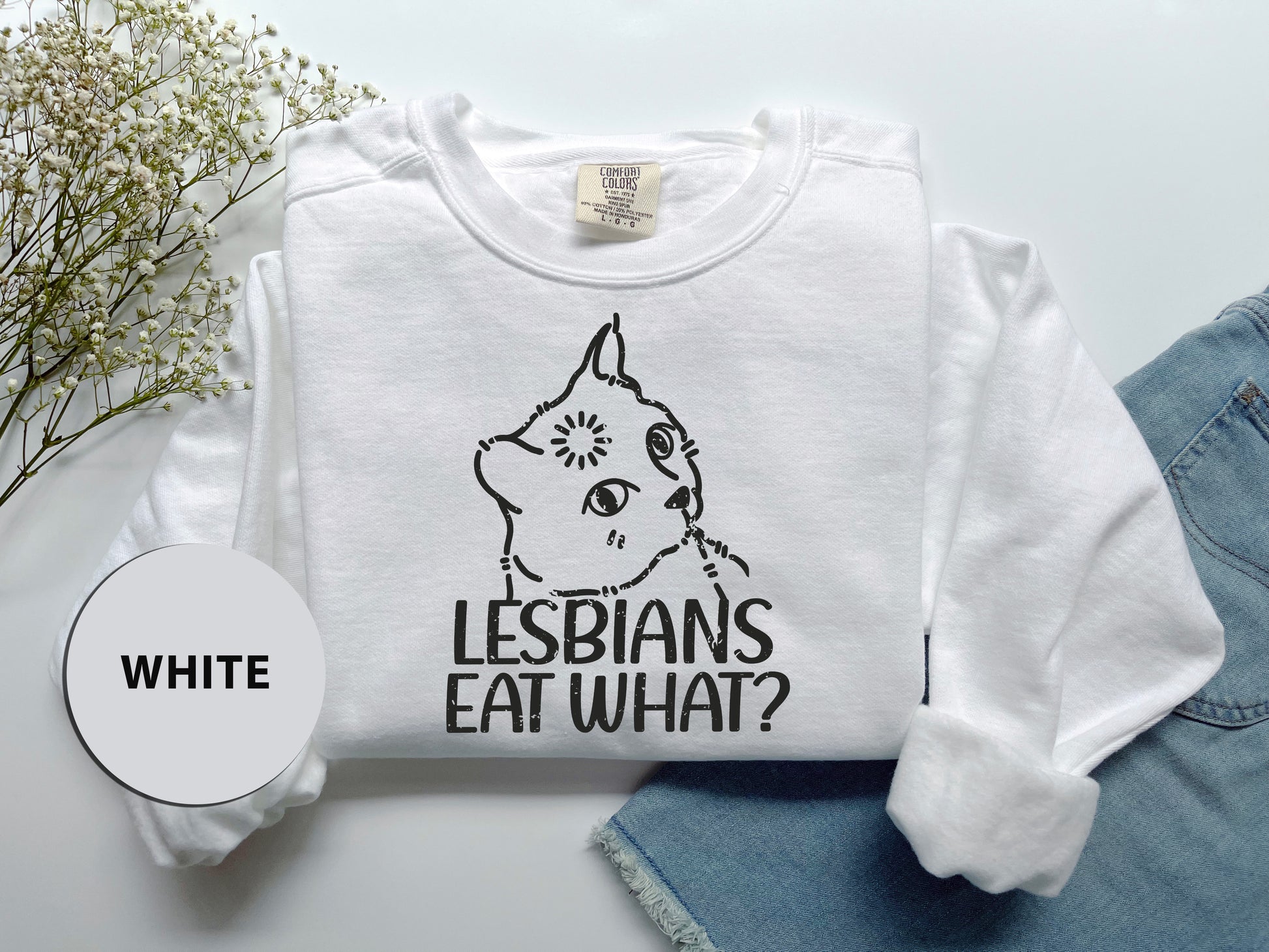 a white shirt with the words lesbians eat what on it