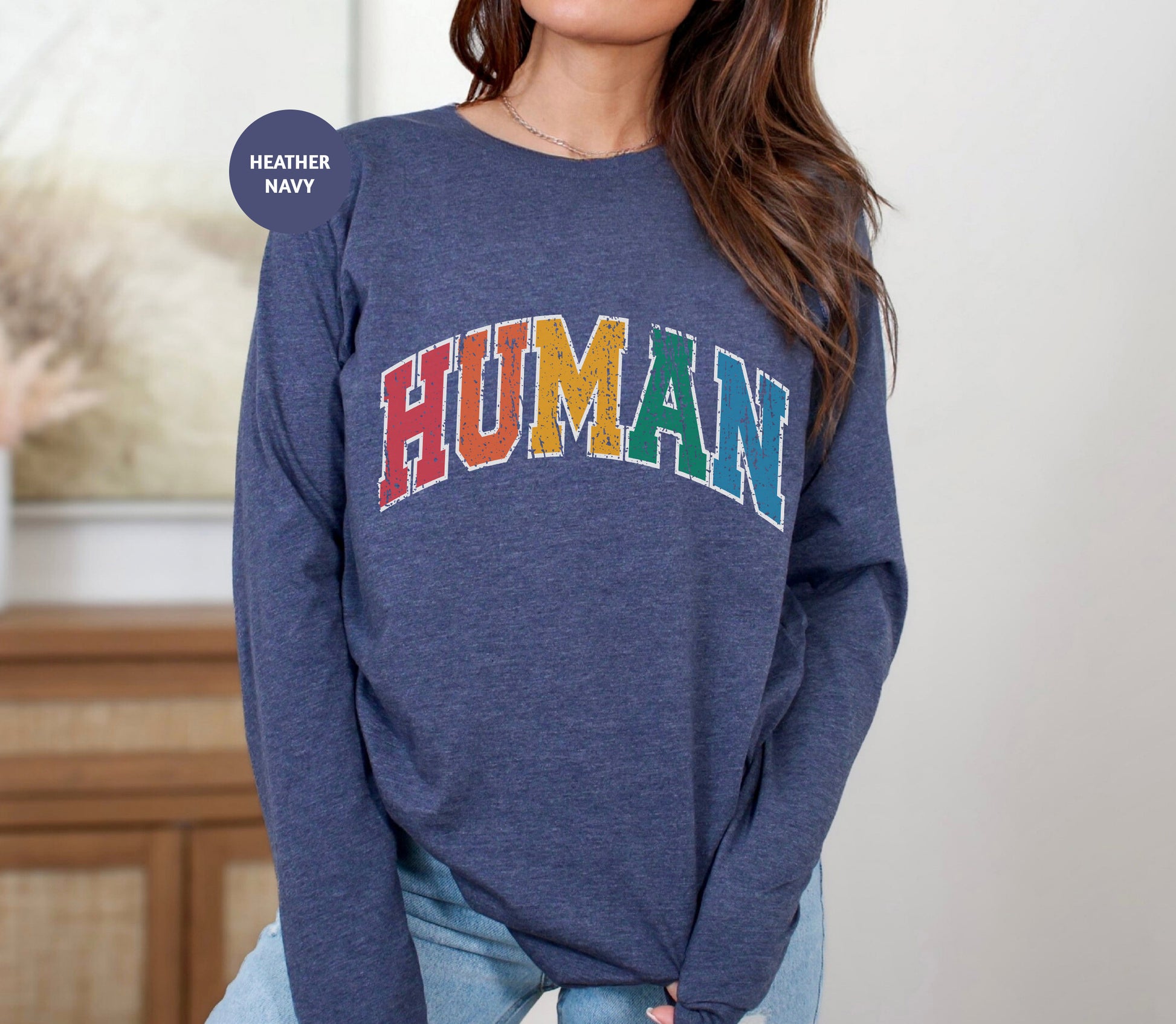 a woman wearing a sweater with the word human on it