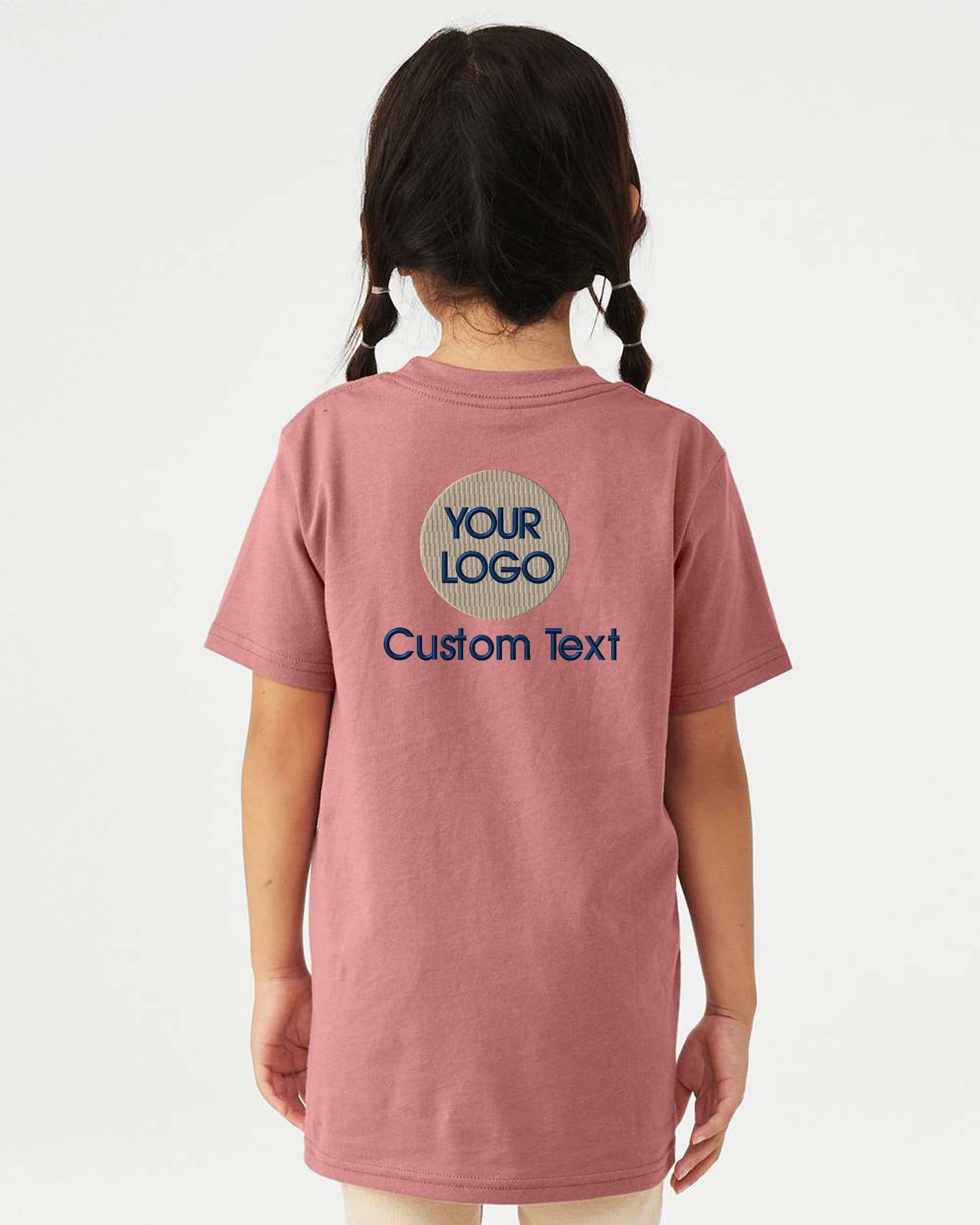 a little girl wearing a pink t - shirt with the words your logo on it