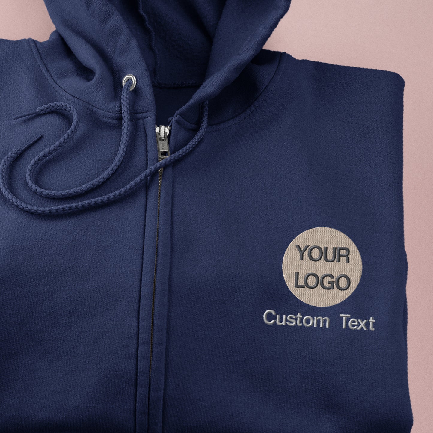 a close up of a blue hoodie with a logo on it