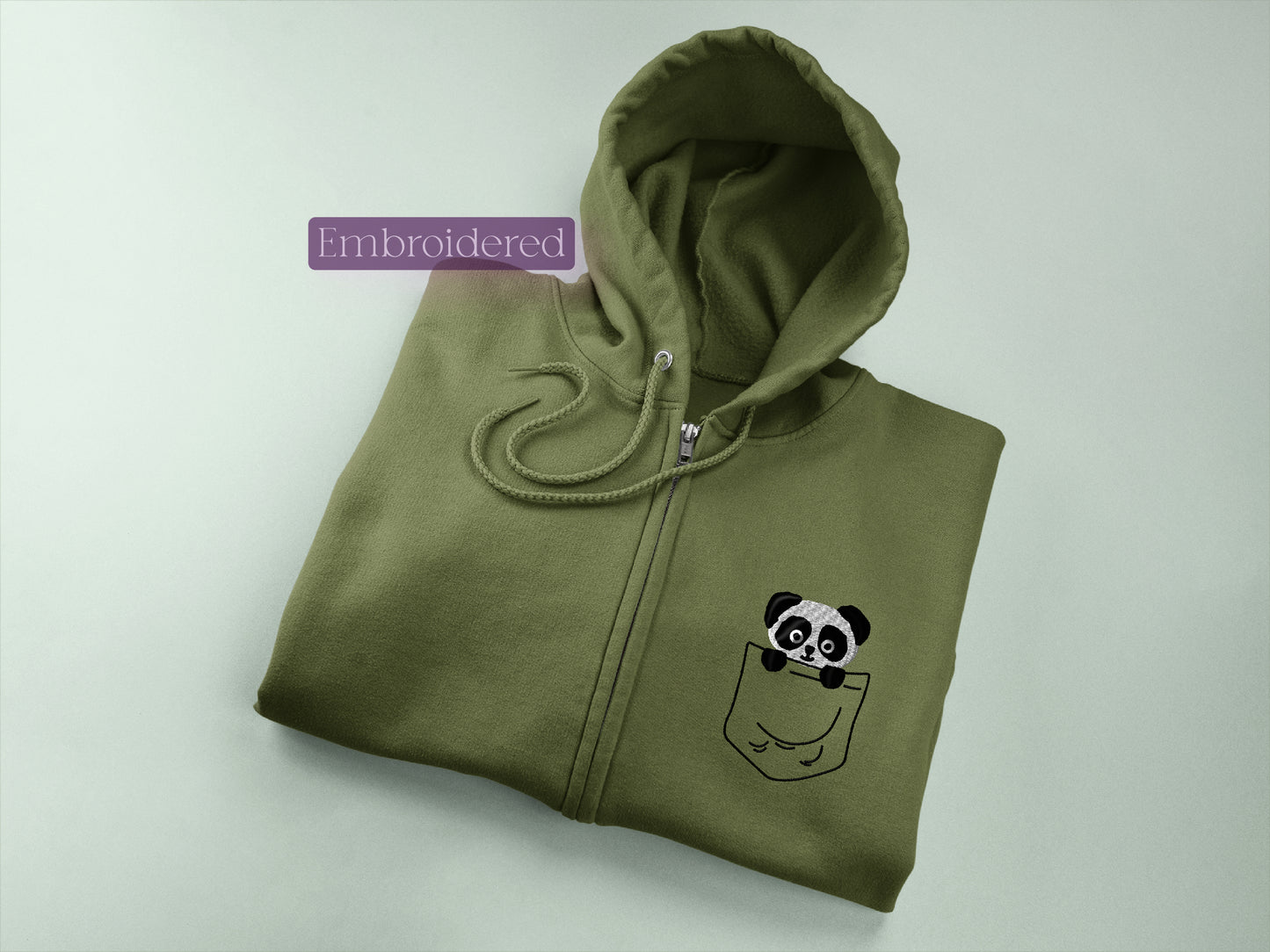 a green hoodie with a panda in a pocket