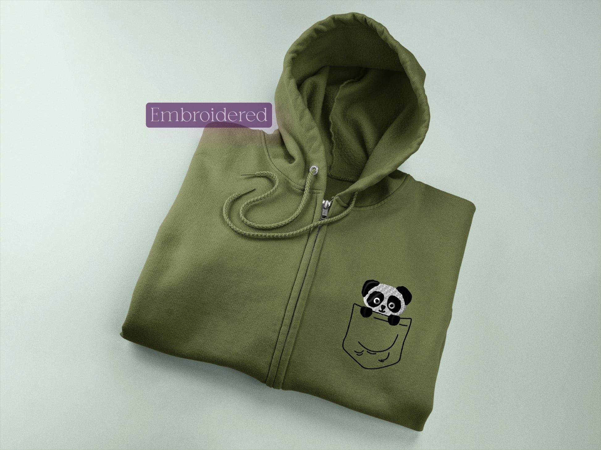 a green hoodie with a panda in a pocket