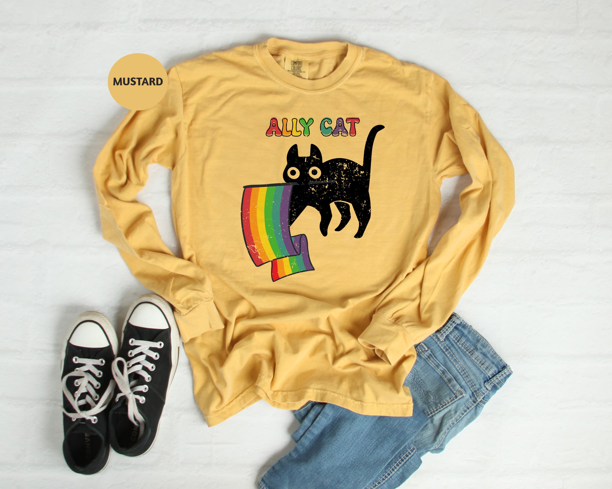 a yellow shirt with a black cat on it