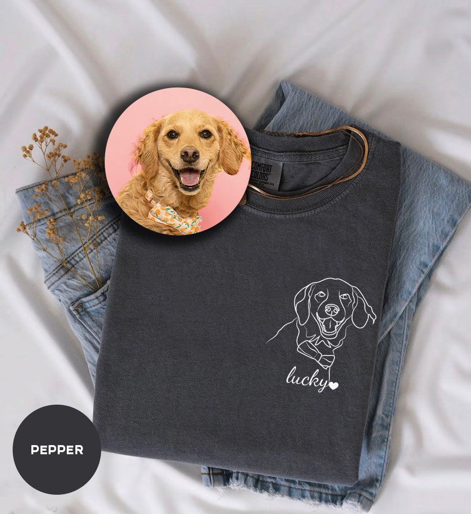 a picture of a dog on a shirt next to a pair of jeans