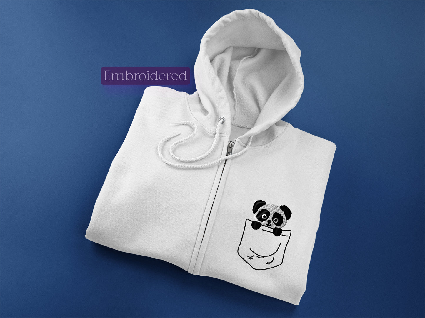 a white zip up hoodie with a panda in a pocket